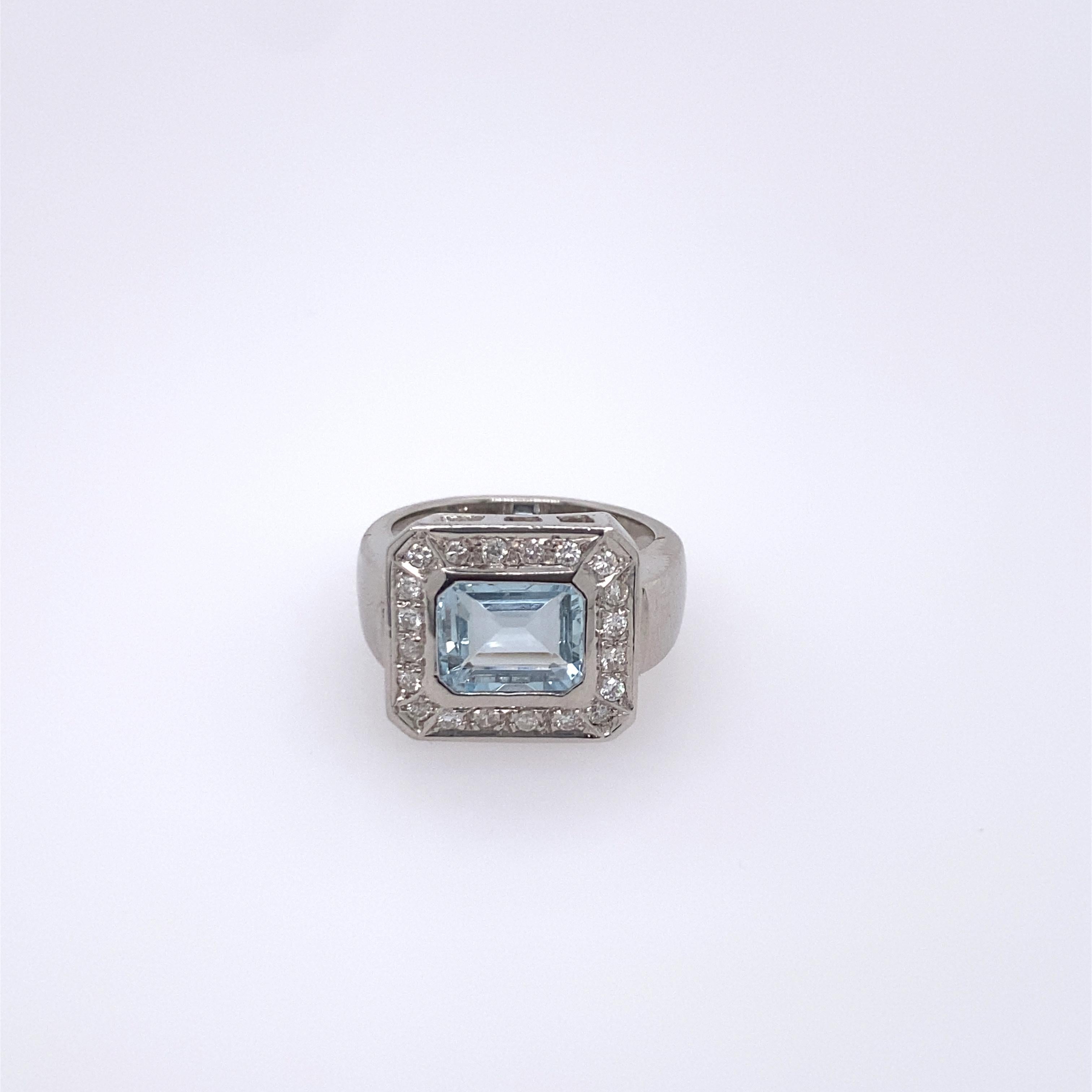 18k white gold ring with approx. 1.63ct aquamarine (measures 8.7 x 6.9 x 3.96mm) surrounded with approx. 0.24ctw in diamonds. Ring size - 7, ring top - 14mm x 15.5mm. Marked 750. Weight - 8.9 grams. 5.72 dwt 