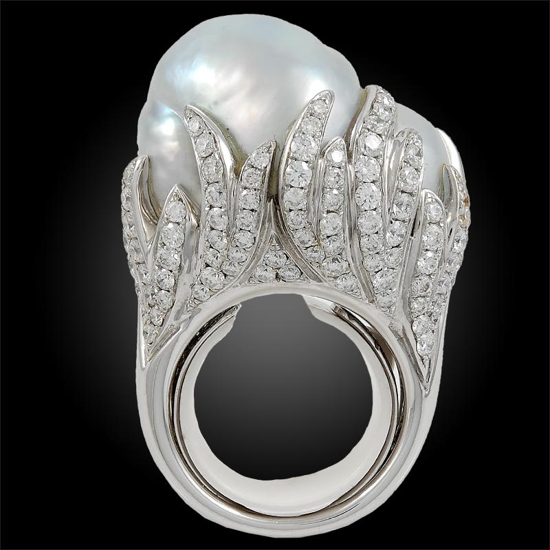 A stunning ring that dates back to the 1980s, centering a large pearl surrounded by pavé set diamonds, finely mounted in 18k white gold.