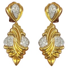 Boucles d'oreilles pendantes en or 18K et diamants