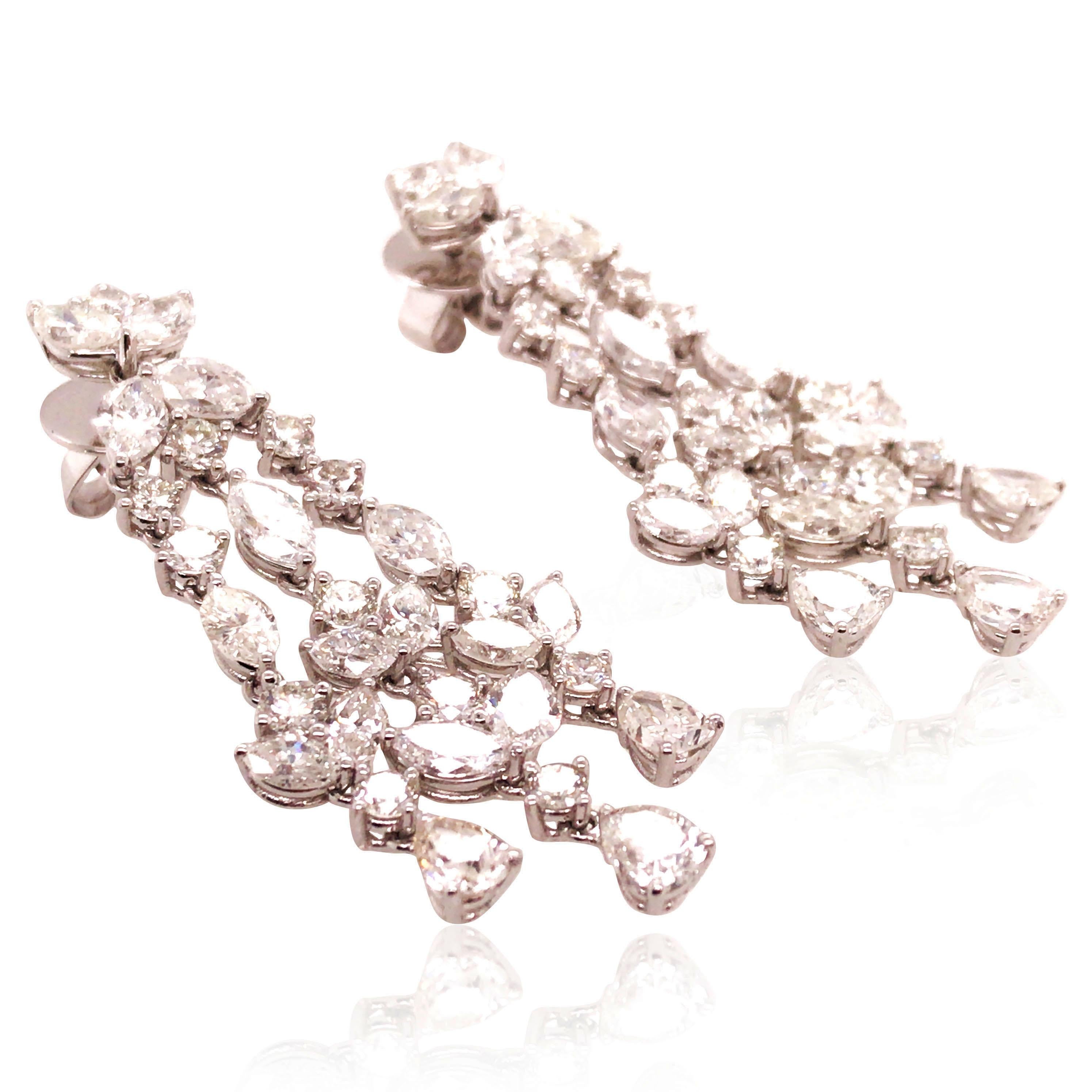 26 round, 6 pear and 30 marquise-shaped diamonds total approx. 7.85ct, H-K/VS-SI. 
