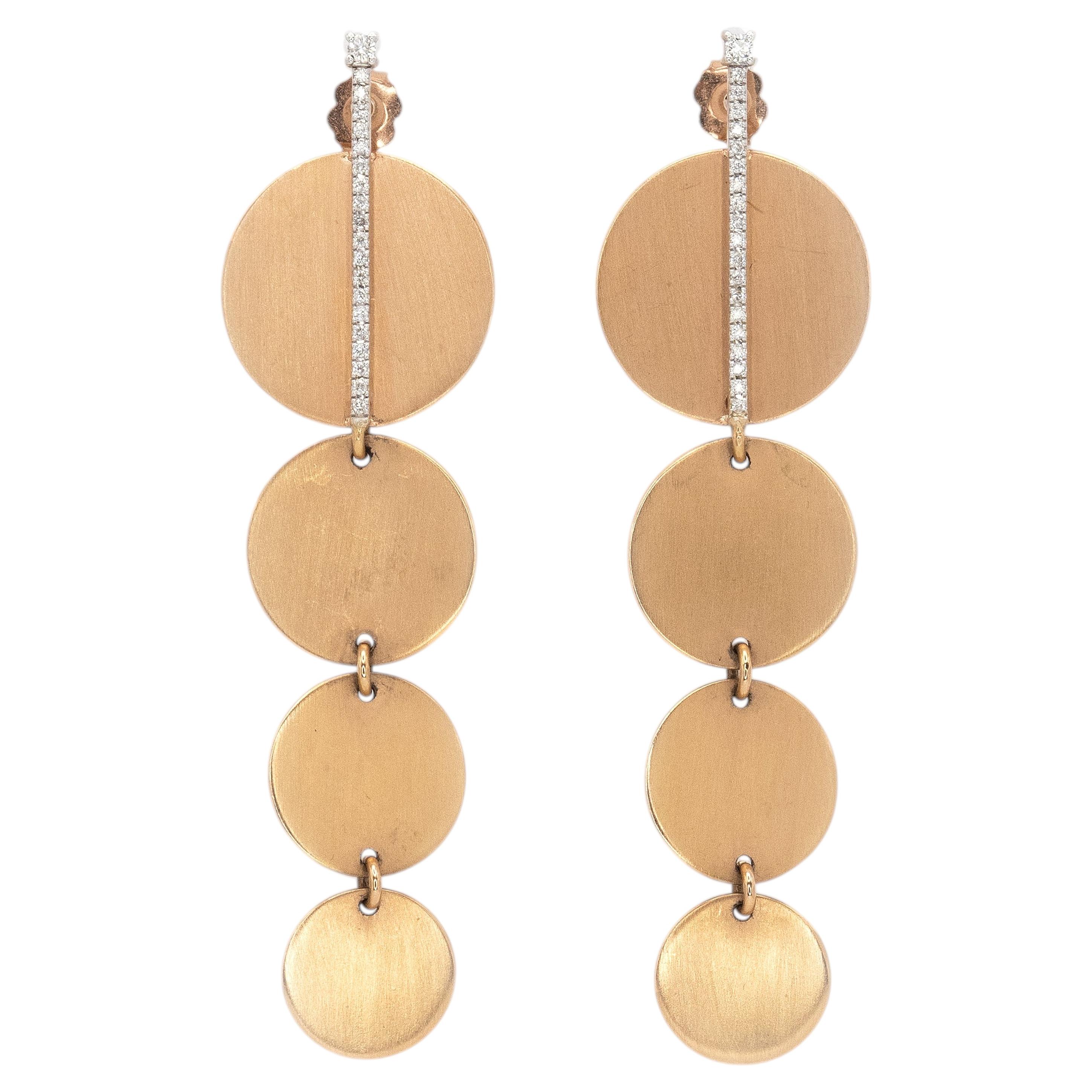 Orecchini pendenti con dischi articolati in oro 18 carati con diamanti e motivi geometrici