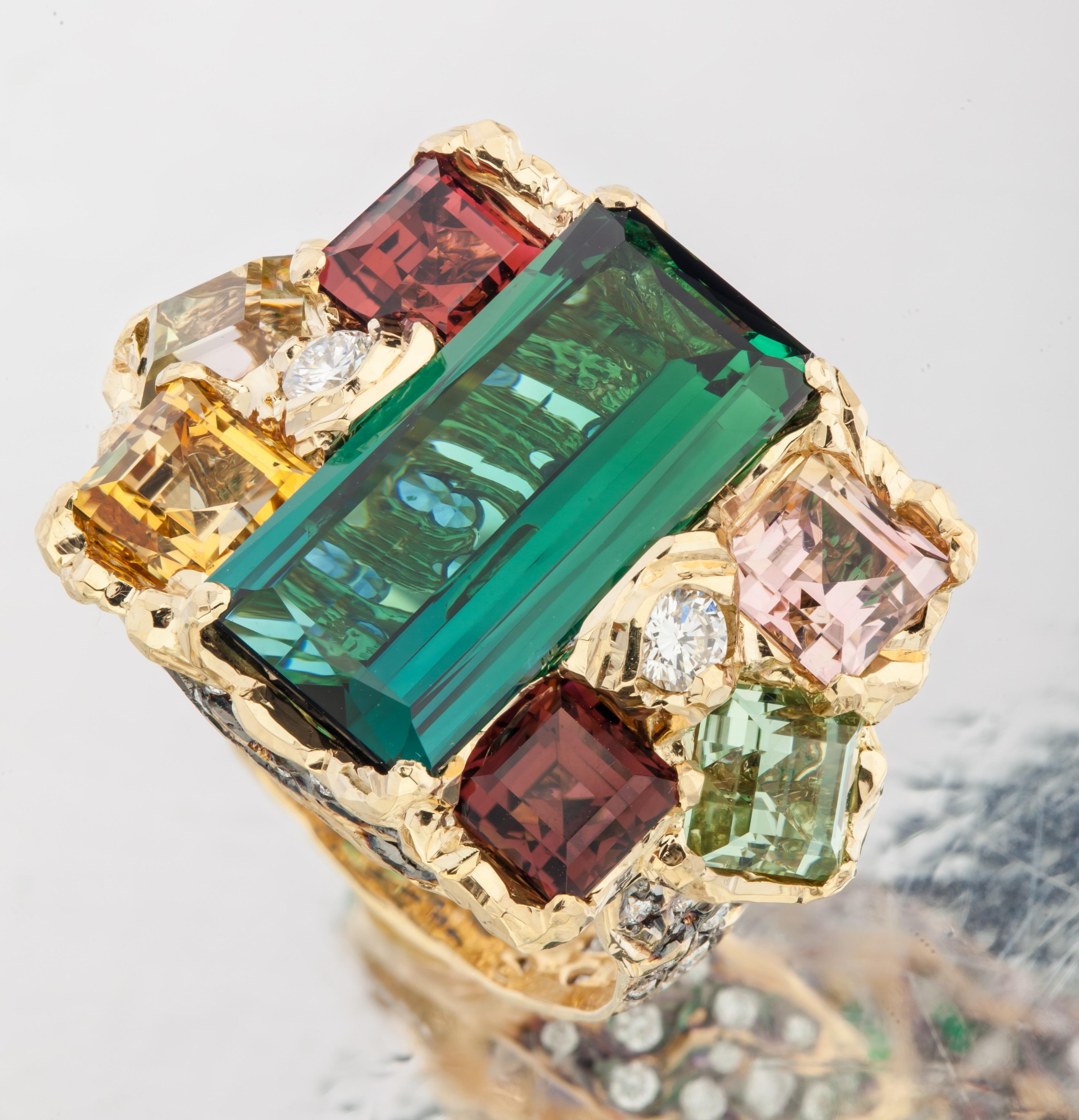Inspired by Impressionism and starry night painting by Van Gogh, MOISEIKIN has created a starry night motif handmade ring lavished with multi colourful gems. Let's find your best star in the spangled stars on the ring.  Central green tourmaline is