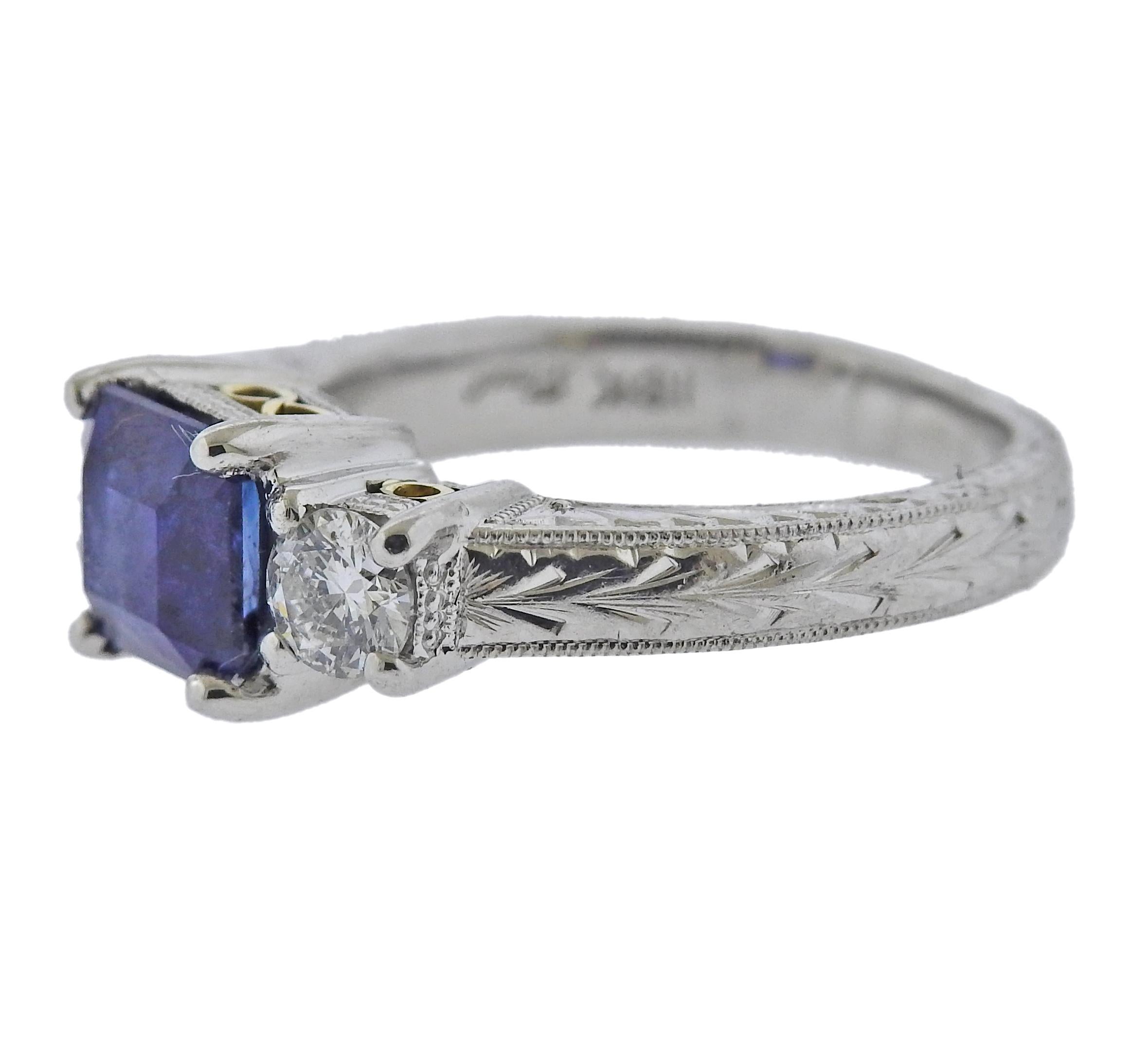 18k gold engagement ring with approx. 0.42ctw in diamonds and 6.13 x 6.3mm sapphire. Ring size 5 (EU 49).  Marked Coast, 18k. Weight 8.4 grams. 