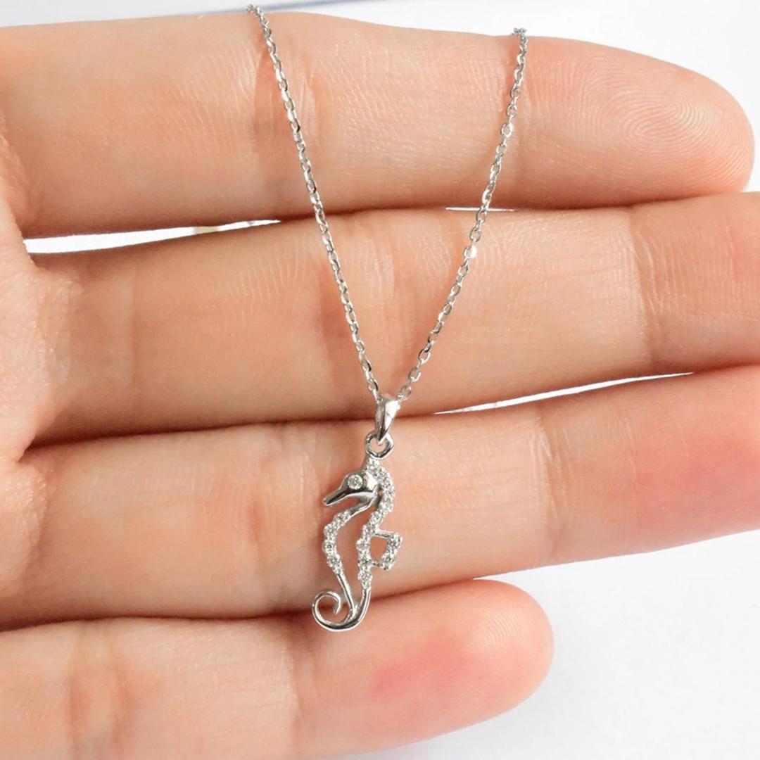 Delicate Dainty Seahorse Charm Necklace with natural diamond is made of 18k solid gold.
Available in three colors of gold: White Gold / Rose Gold / Yellow Gold.

Lightweight and gorgeous natural genuine round cut diamond each diamond is hand