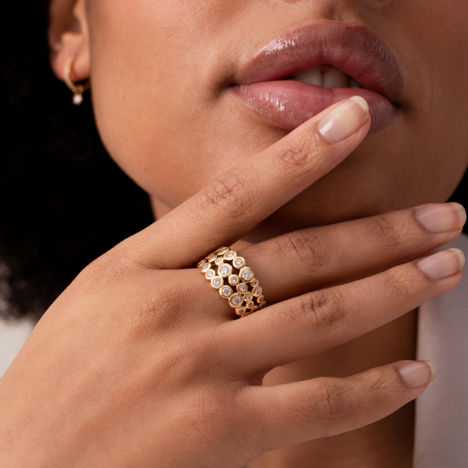 Handcrafted in 18k yellow gold at our London studio, this striking Dotty design ring is generously set with an assortment of sparkling white diamonds, making it the perfect statement accessory. Made with recycled 18k gold. Other ring sizes available