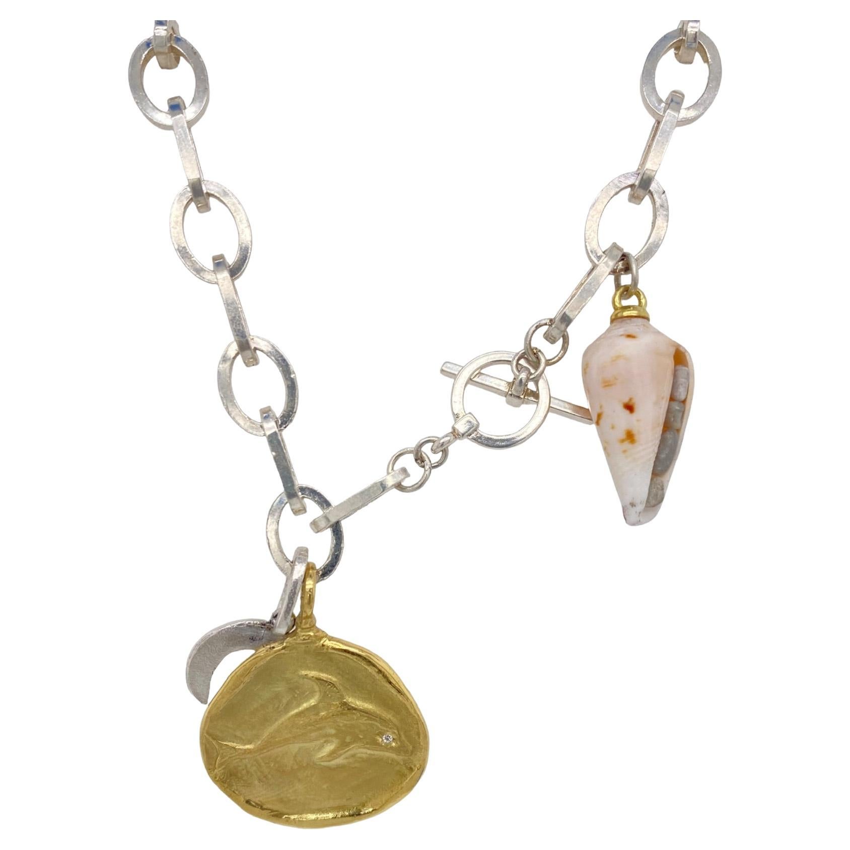 18k gold dolphin shield and shell necklace with diamonds For Sale