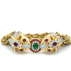 Bracelet en or 18 carats à double tête de lion et chaîne à plusieurs cordes avec rubis et diamants