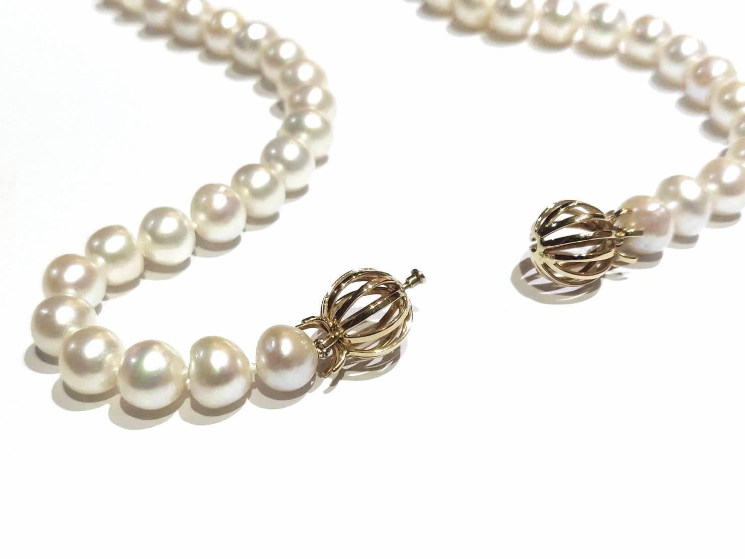 Contemporary 18K Gold Double Lined Ball Cage Clasp Single Strand Long Cultured Pearl Necklace For Sale