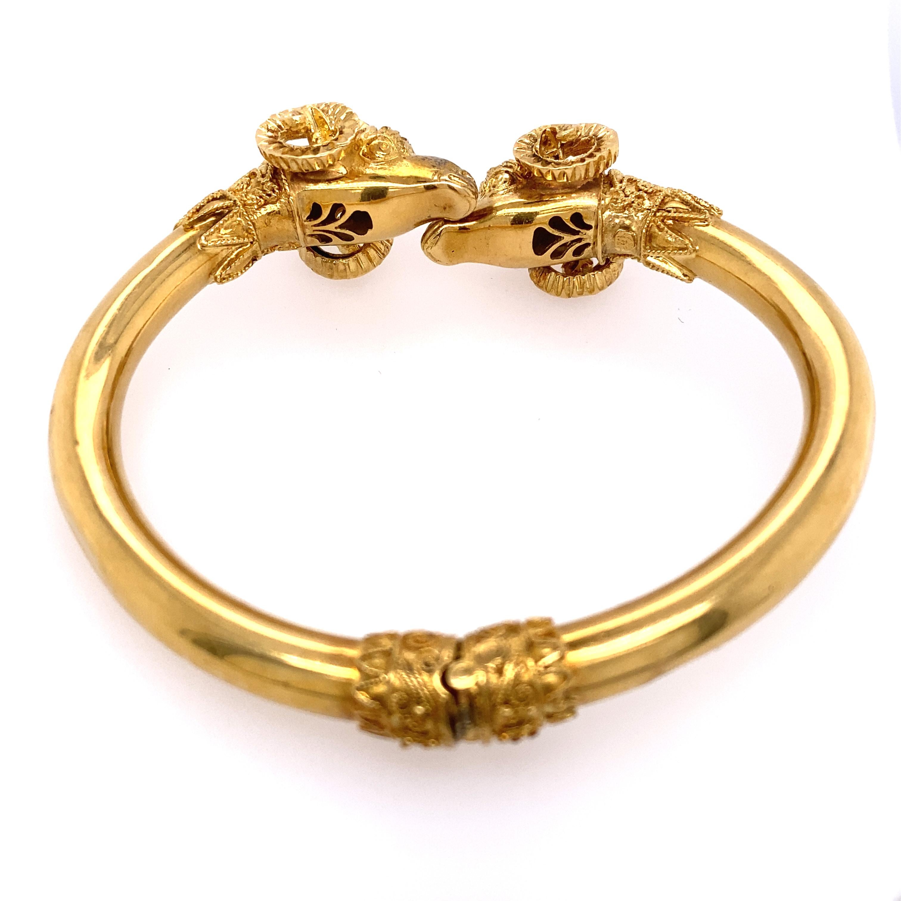18k Gold Double Ram Head Bangle 
Most likely Lalaounis or Zolatas, not signed. 
Total weight 30.6 dwt. Bracelet is flexible and will fit size 6 inches - 8 inches.