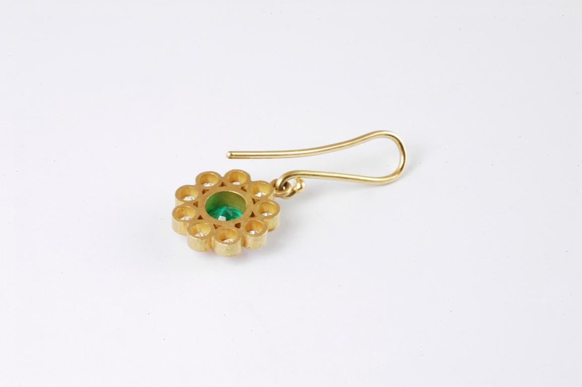 18ct gold drop flower earrings with round emeralds 1ct and brilliant cut diamonds 0.81cts total  handmade in Notting Hill London by renowned British jewellery designer Malcolm Betts. Delicate flower shape drop earrings with 18K gold wire and