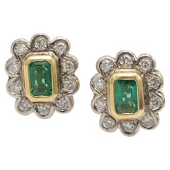 18k Gold earrings with emeralds and diamonds.