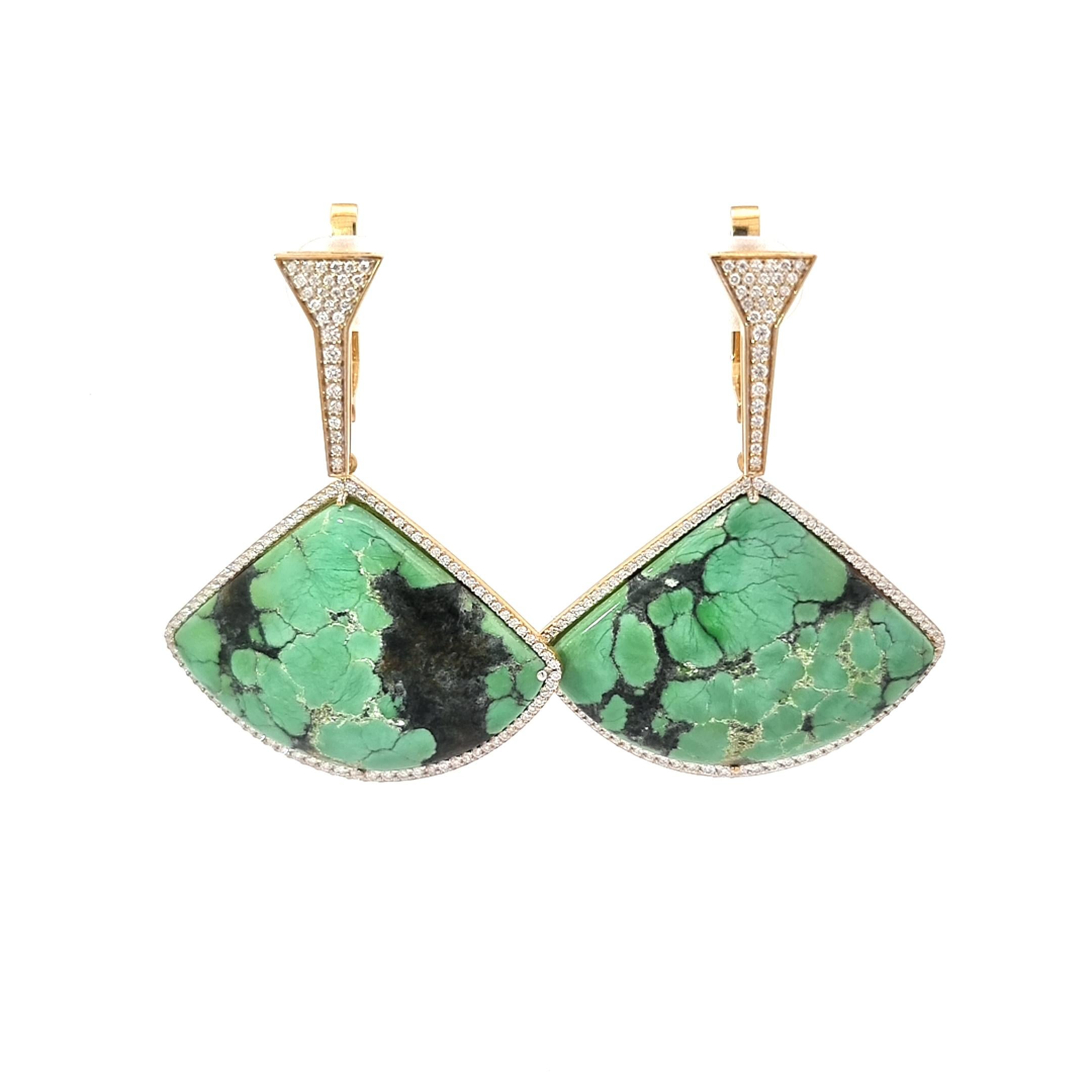 Elevate your elegance with VOTIVE's latest masterpiece – a pair of gold earrings that redefine luxury. Featuring captivating green triangular-shaped turquoise, each carefully chosen for its vivid hue and natural allure, these earrings embody the