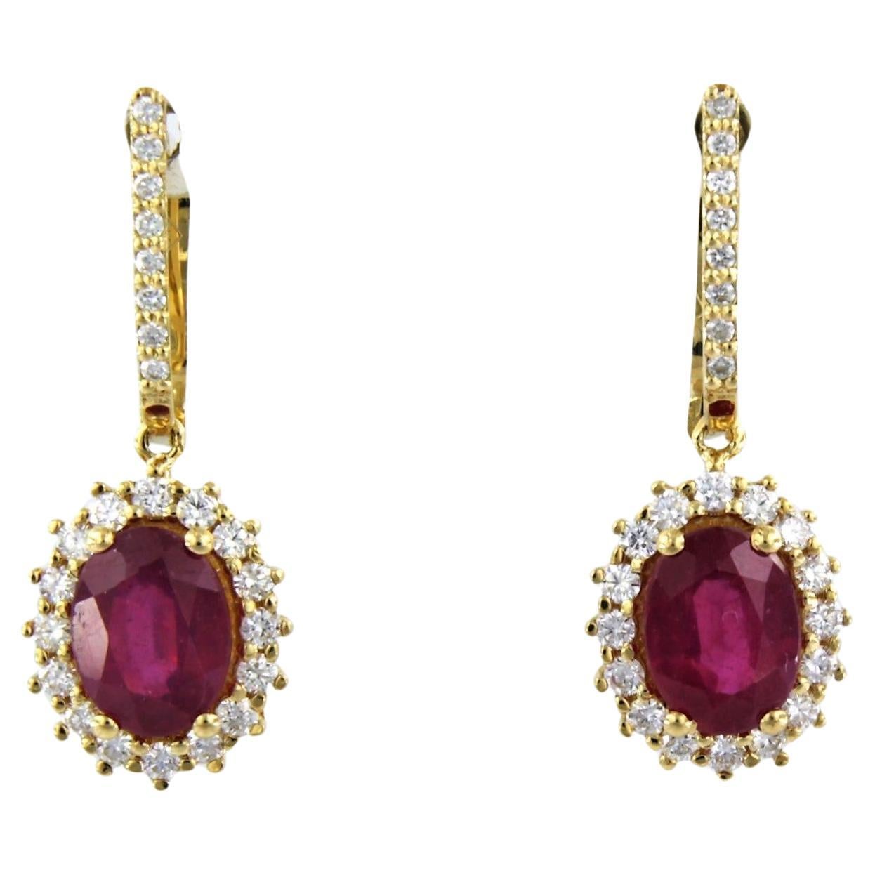 18k gold earrings with ruby to. 3.40ct and brilliant cut diamonds up to.0.64ct For Sale