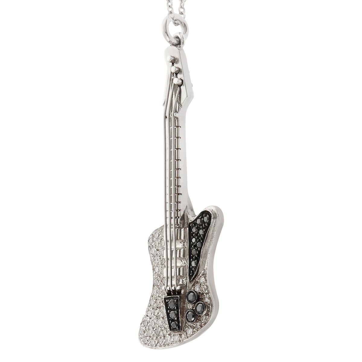 18k white gold Electric Guitar Pendant pavé set with White and Black diamonds hanging on a thin 18k white gold chain 50cm in total length. 25cm drop (approximately). 