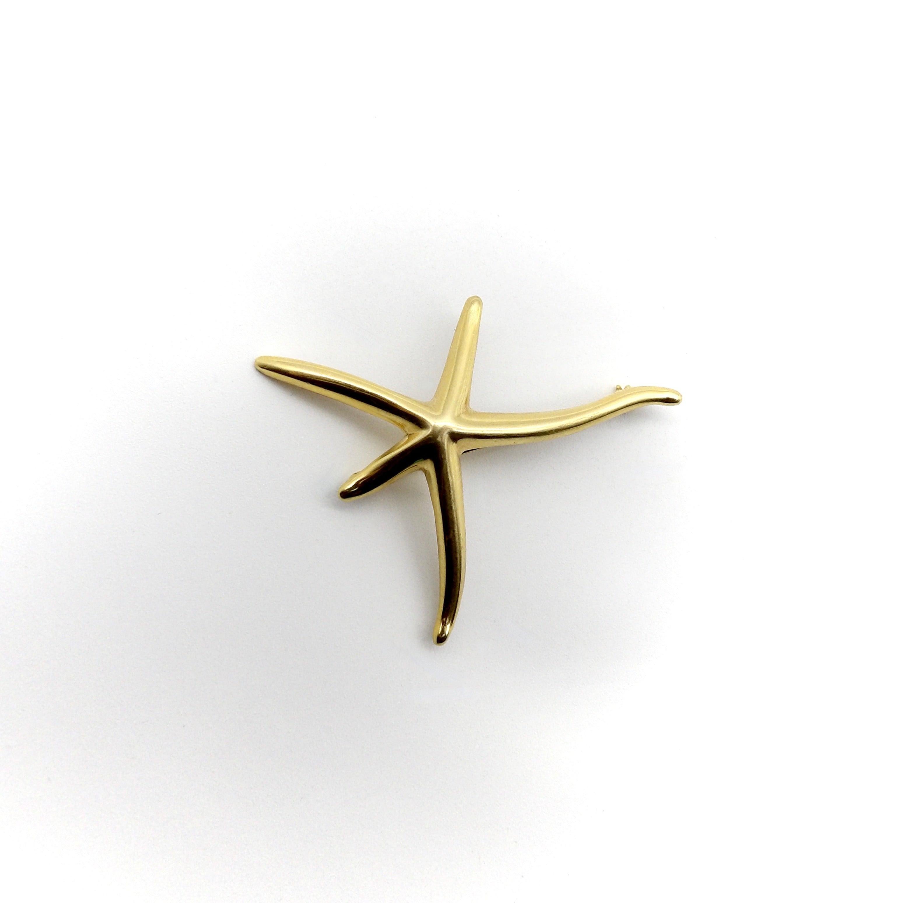 This lyrical starfish brooch exemplifies the playful and organic qualities of an Elsa Peretti design. Circa 1990, this is an earlier version of Elsa’s infamous starfish jewelry for Tiffany & Co. The legs of the starfish outstretch at different
