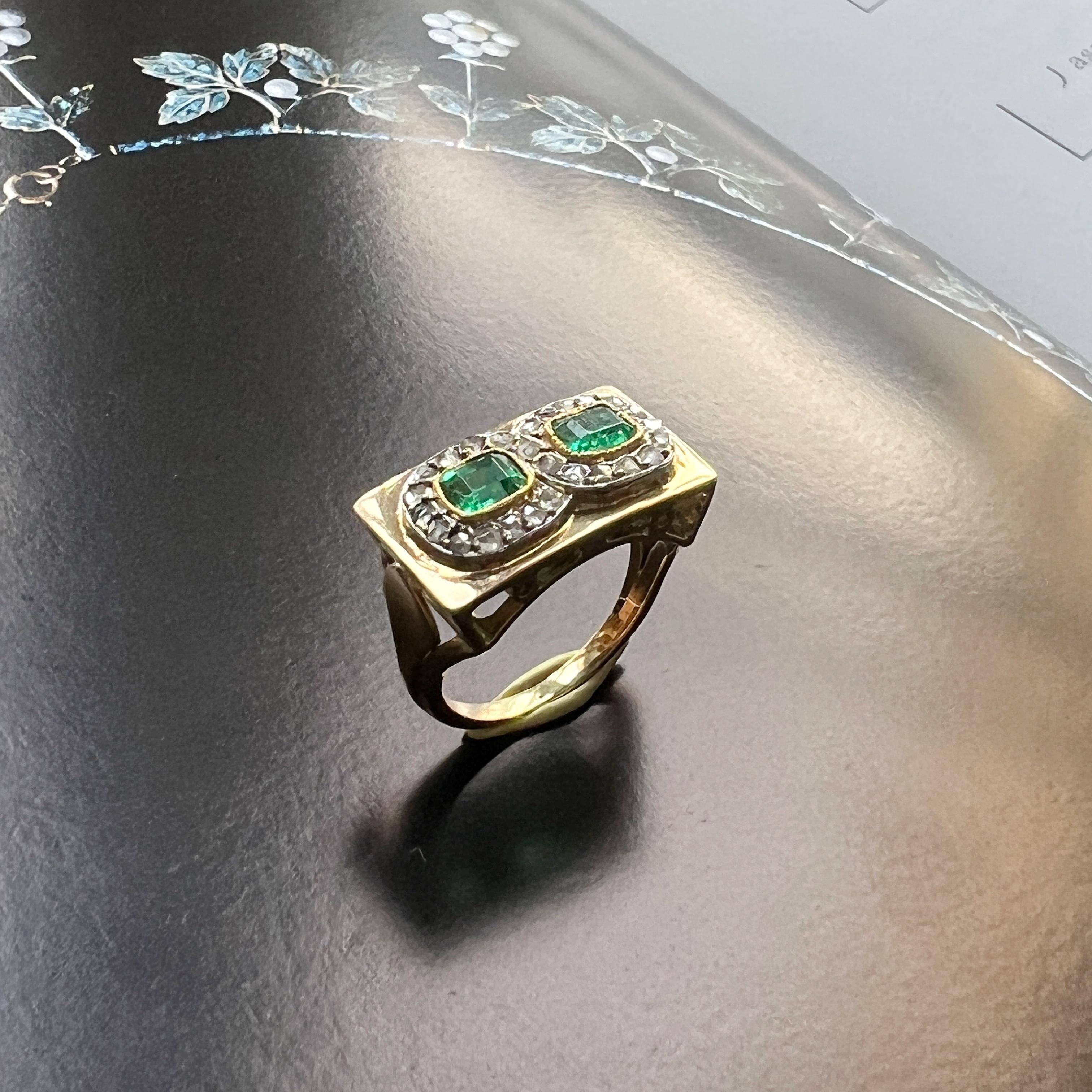 For sale a beautiful French made, 18K gold tank ring, which transports you to the glamorous era of the 1940s.

This chic ring encapsulates the essence of an eternity motif, accentuated by two resplendent emeralds framed by a series of captivating
