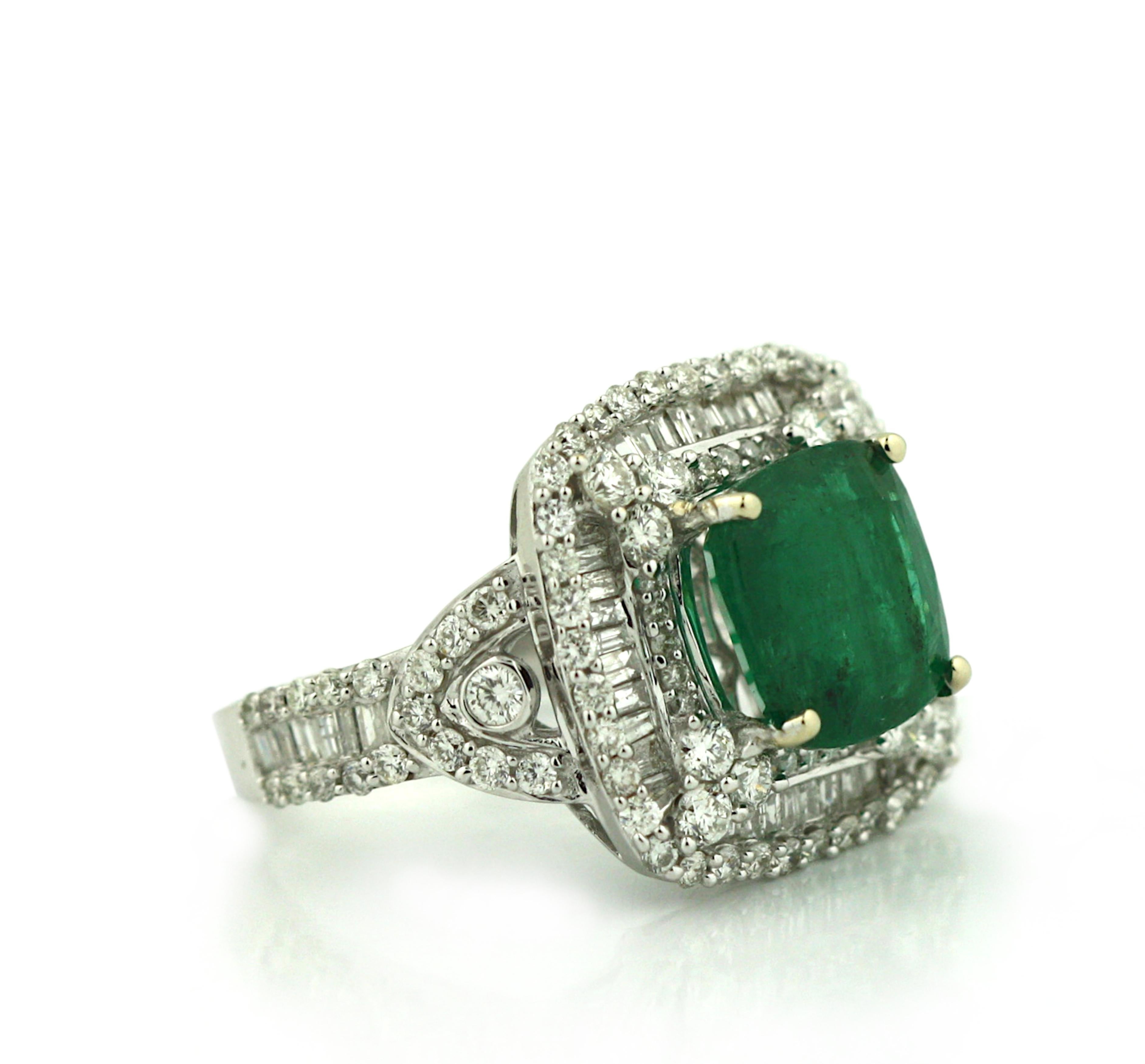 18K Gold Emerald and Diamond Ring 
Centered by a step-cut, octagonal natural Emerald 
Weighing 4.24 cts. 
Measuring 10.4 x 9.5 x 5.8 mm 
Within a surround of one hundred sixty baguette and round brilliant cut diamonds
weighing 2.28 cts. 
Total
