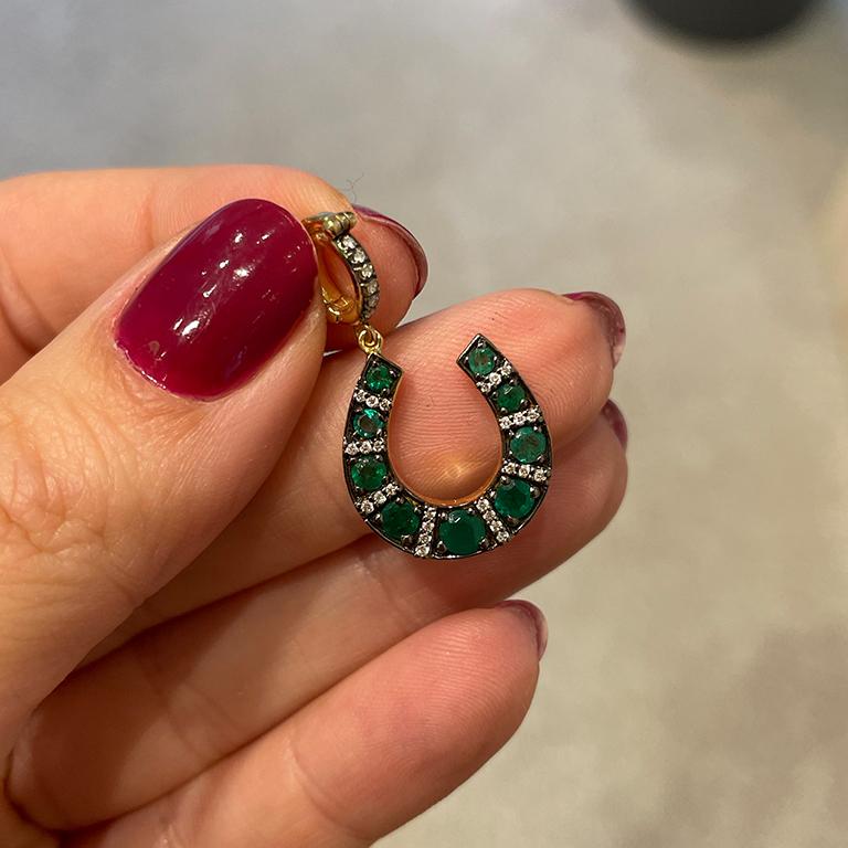 Crafted in our workshop in Beirut, this 18k gold Horseshoe pendant is embellished with emeralds and white diamond and designed to bring you good luck! The diamond encrusted bezel opens to allow you to securely hook it to any chains. Wear it with our