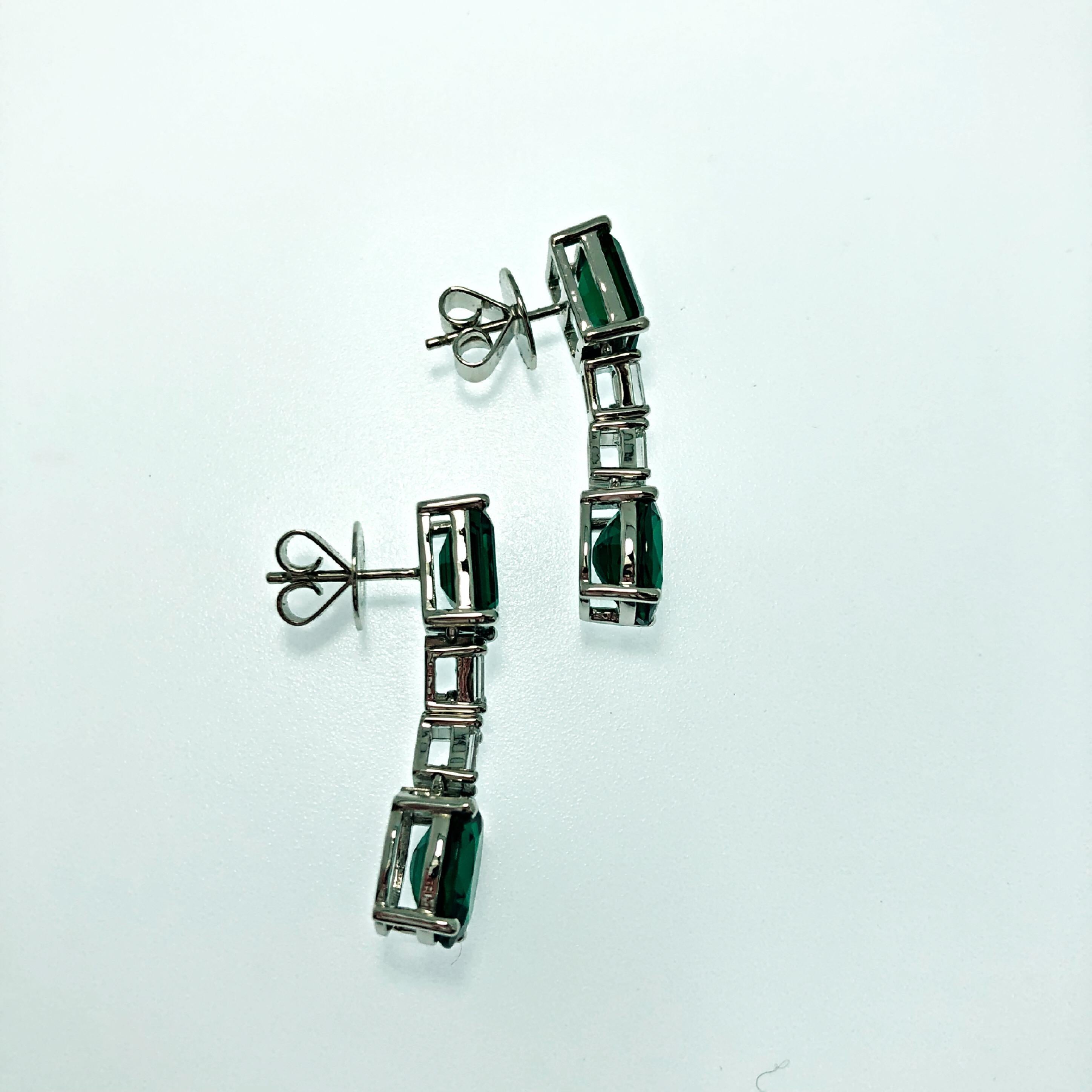 A pair of earrings made to spark the most extravagant events and red carpets.
showcasing LAB grown deep vivid green Emeralds of 8.48ct in total , emerald and brilliant cut natural diamonds of top range quality weighing a total of 1.03ct
A true