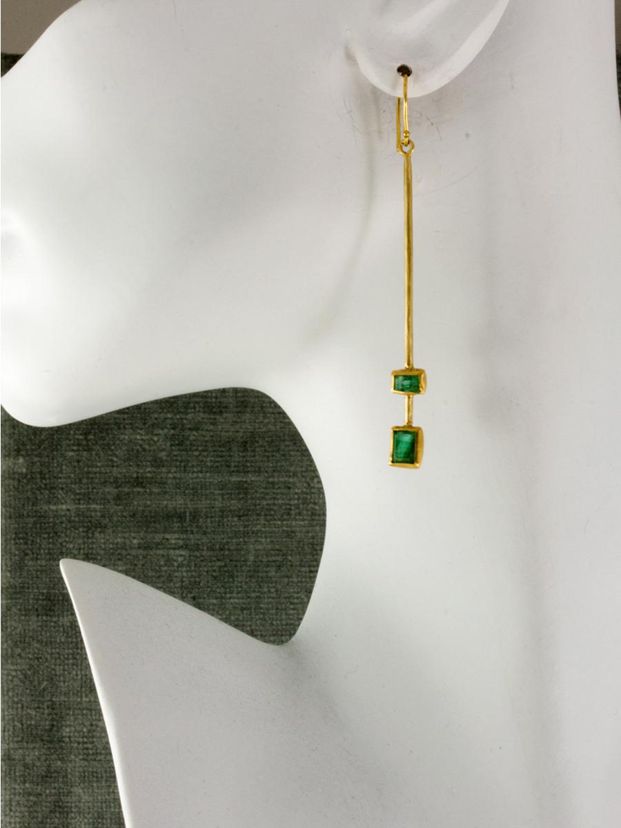 Art Deco inspired, these emerald earrings are completely handcrafted of 18k recycled gold with over 3 carats of geometrically shaped emeralds.  A modern twist on a classic style. 18k gold ear wires for pierced ears.

18k recycled gold, 3.2 carat