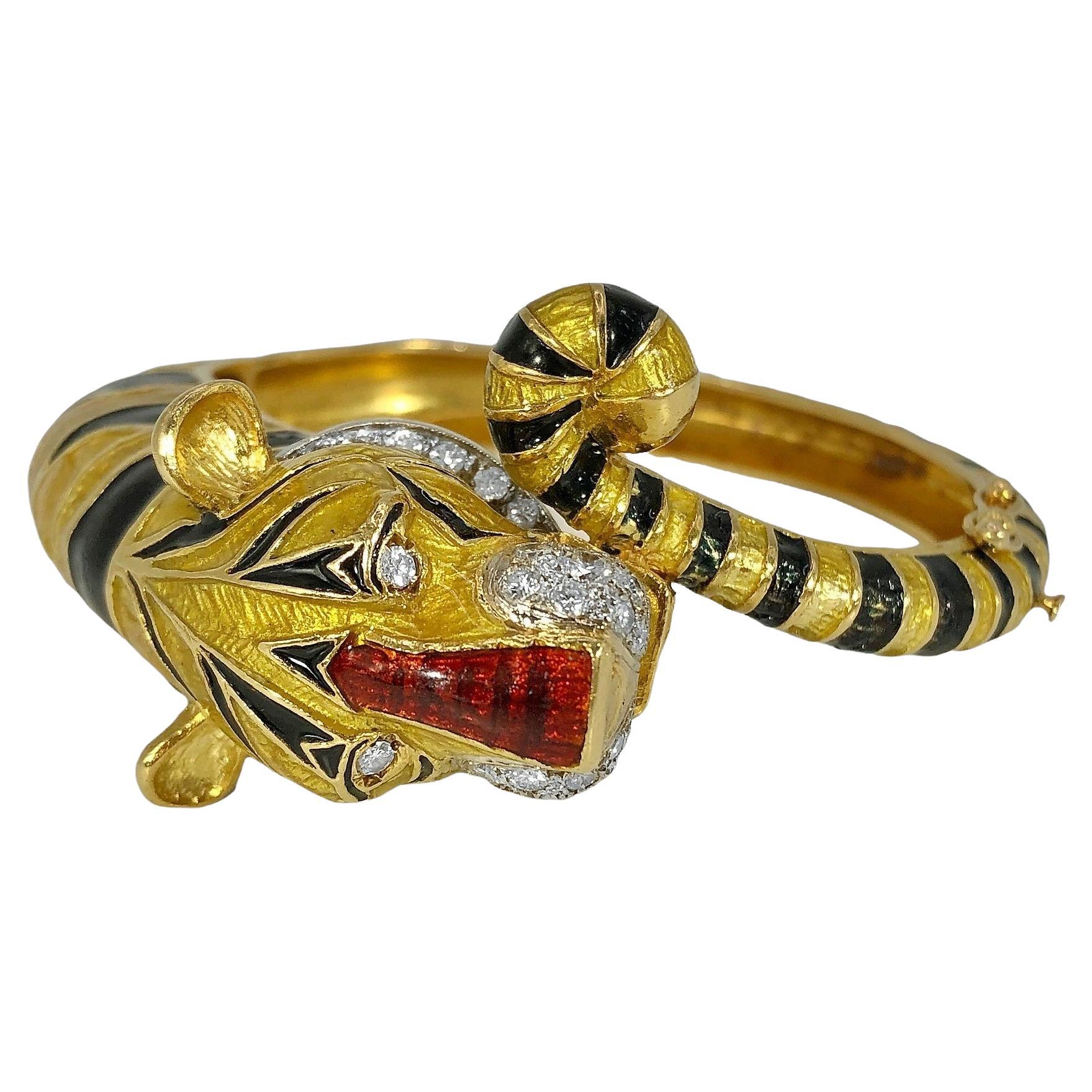 This striking Mid-20th Century Tiger motif hinged bangle bracelet is adorned with bright transparent gold and jet black opaque enamel. The life like head and collar are set generously with brilliant cut diamonds having a 1.50ct total approximate