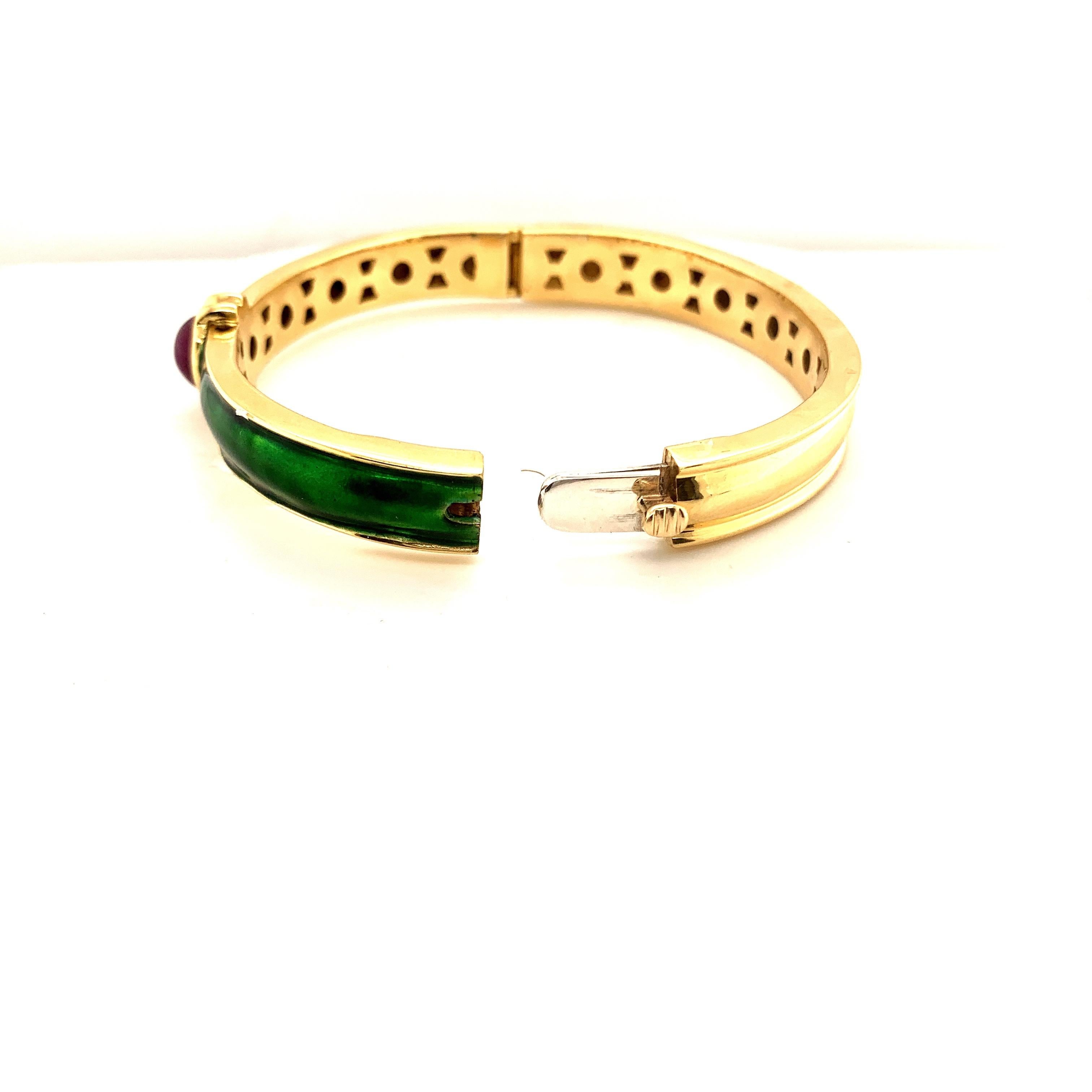 Pair of striking enamel bracelet bangles. one set with Cabochon Ruby and the other set with Cabochon Emerald. With Each bangle individually weighing 42 grams of 18k Gold, This pair of enamel bangles are unique and pretty.
A great addition to any