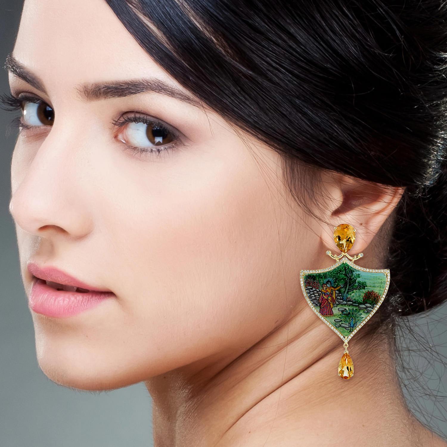 These beautiful enamel art is inspired by Royal Indian heritage during Mughal Era. These earrings feature a unique hand painted miniature art set with 18K gold.  It is set in 13.9 carats citrine, 36.85 carats Mother of Pearl and 1.26 carats of