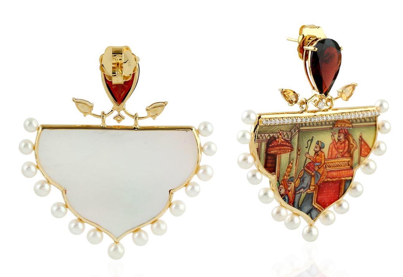 Inspired by Royal Indian heritage during Mughal Era.  These intricate earrings feature a unique hand painted miniature art set with 18K gold, diamonds and pearls.  It is hand set with 8.88 carats garnet, 0.68 carats of citrine, 8.43 carats Mother of