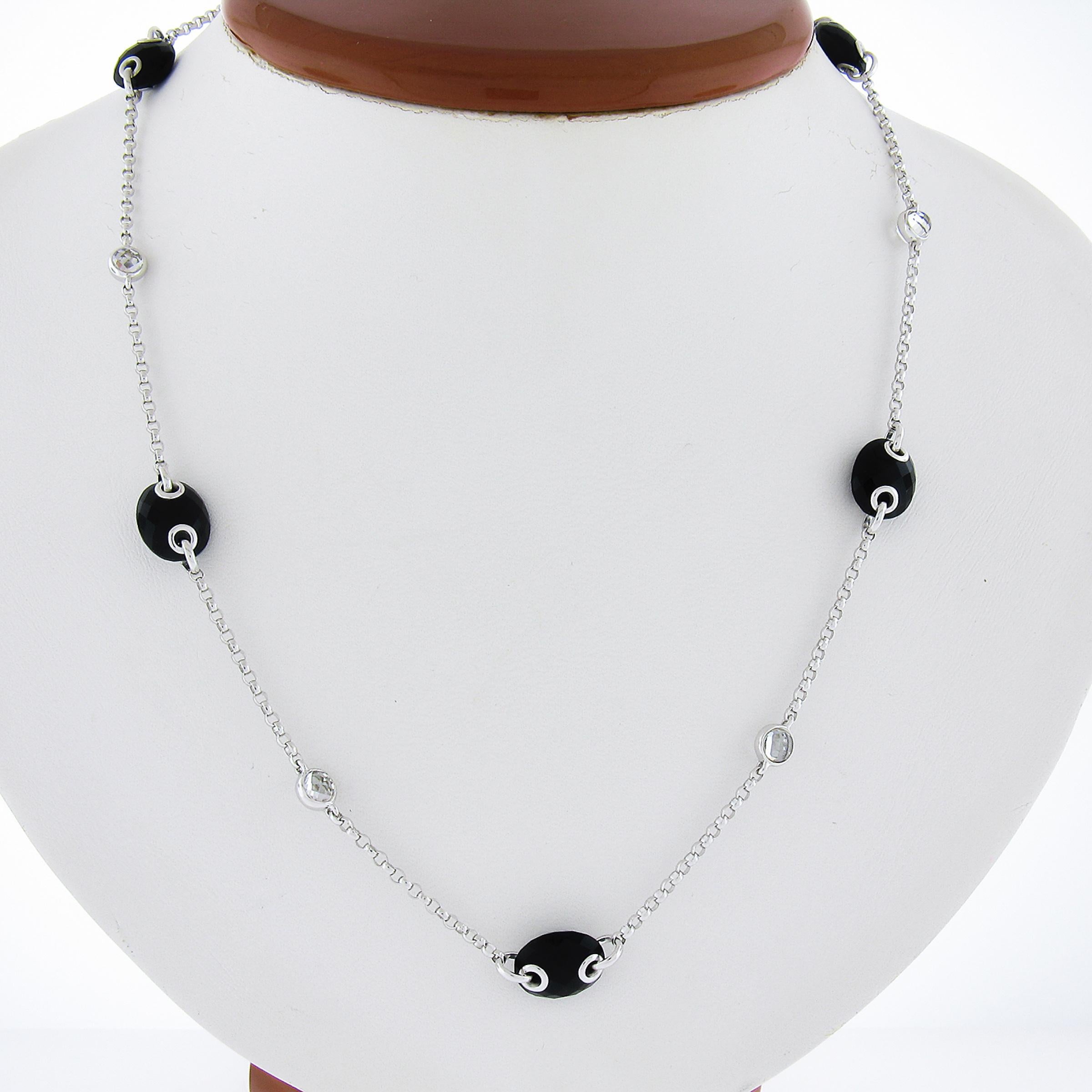 --Stone(s):--
(5) Natural Genuine Black Onyx - Faceted Oval Cut - Black Color - 11.1x8.9mm (approx.) 
(5) Rock Crystal - Faceted Round Cut - Bezel Set - Transparent Color - 3.8mm (approx.)

Material: 18k Solid White Gold
Weight: 12.09 Grams
Chain