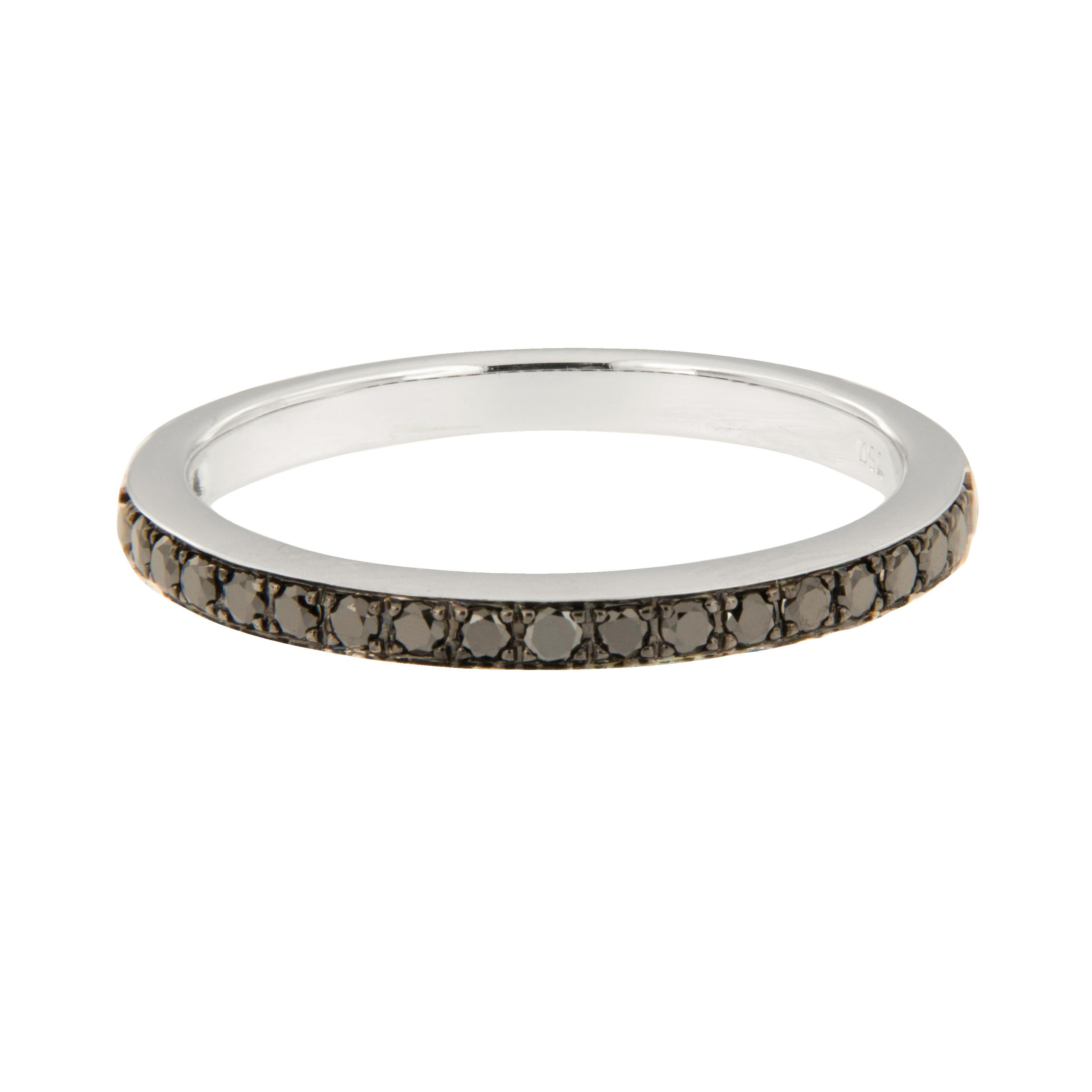 Tuxedo black diamonds accent the top of this band that can be worn alone or also looks fantastic stacked! Black goes with everything which makes this ring versatile. 18 karat white gold with 21 black diamonds = 0.20 Cttw. in a size 5.25.

Diamonds =