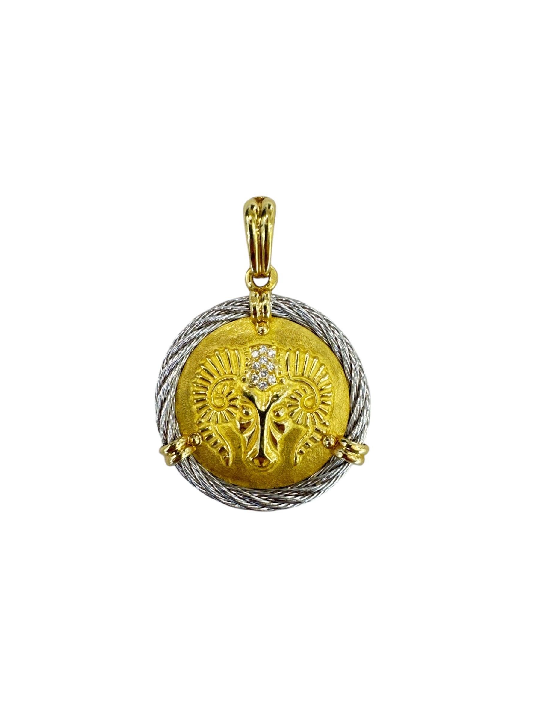 This stunning jewelry set is part of the Force 10 Collection by Fred Paris, renowned for its bold, nautical-inspired designs. The centerpiece features a striking medallion crafted from gleaming gold, depicting an intricately designed ram’s head—a