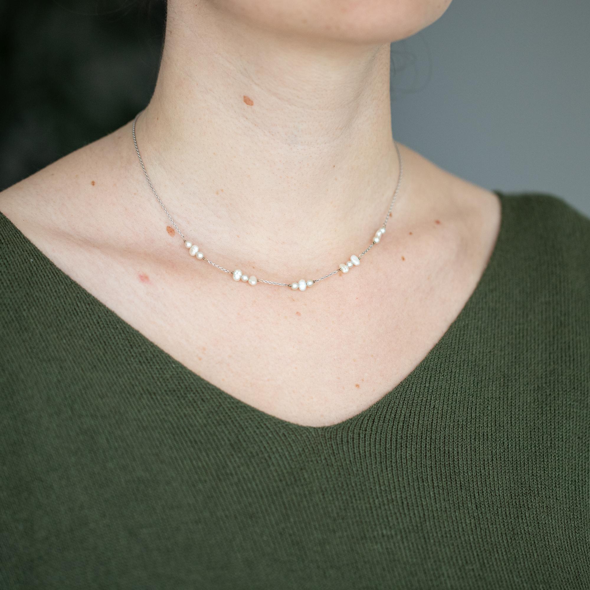 For sale is this beautiful and elegant white gold necklace. 15 royal oval and round shaped pearls give the necklace a romantic look. This thin necklace is very classy and is the right necklace to upgrade your day to day outfit. This beauty is