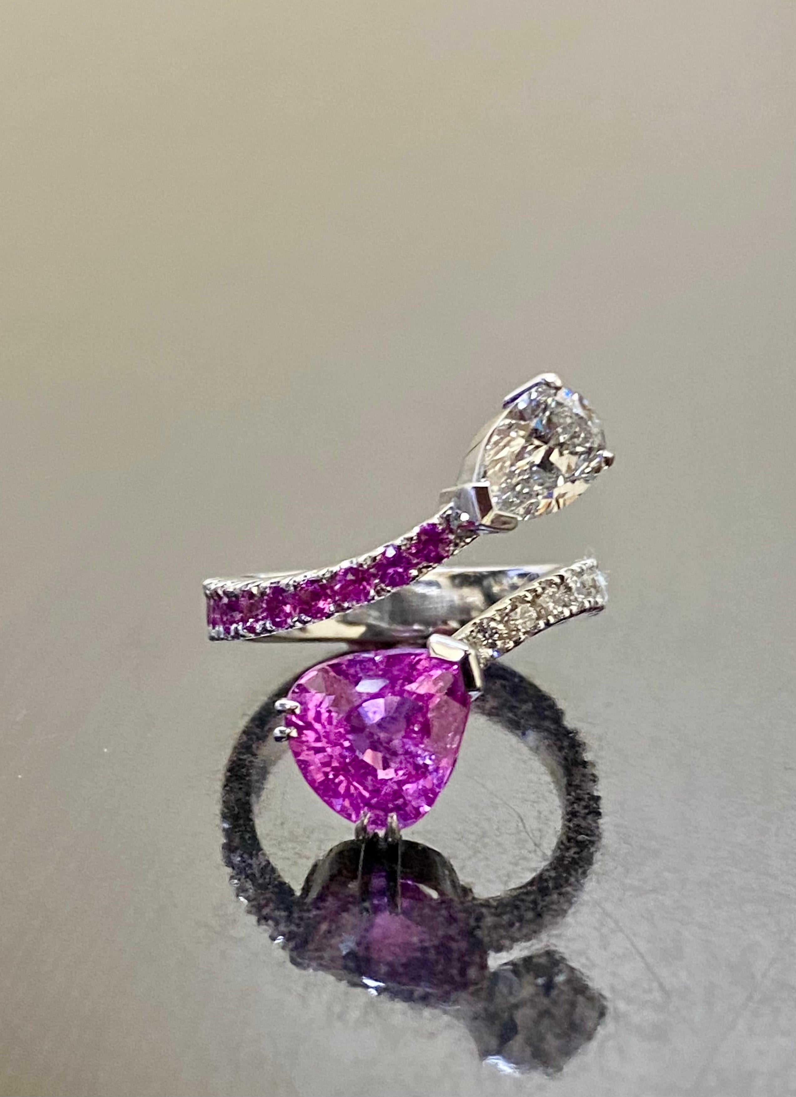 DeKara Designs Collection

Metal- 18K White Gold, .750.

Stones- GIA Certified Pear Shape Purplish Pink Sapphire 3.03 Carats, GIA Certified Pear Shape Diamond H Color I1 Clarity 0.93 Carats. 9 Round Diamonds G Color VS1-VS2 Clarity 0.50 Carats, 9