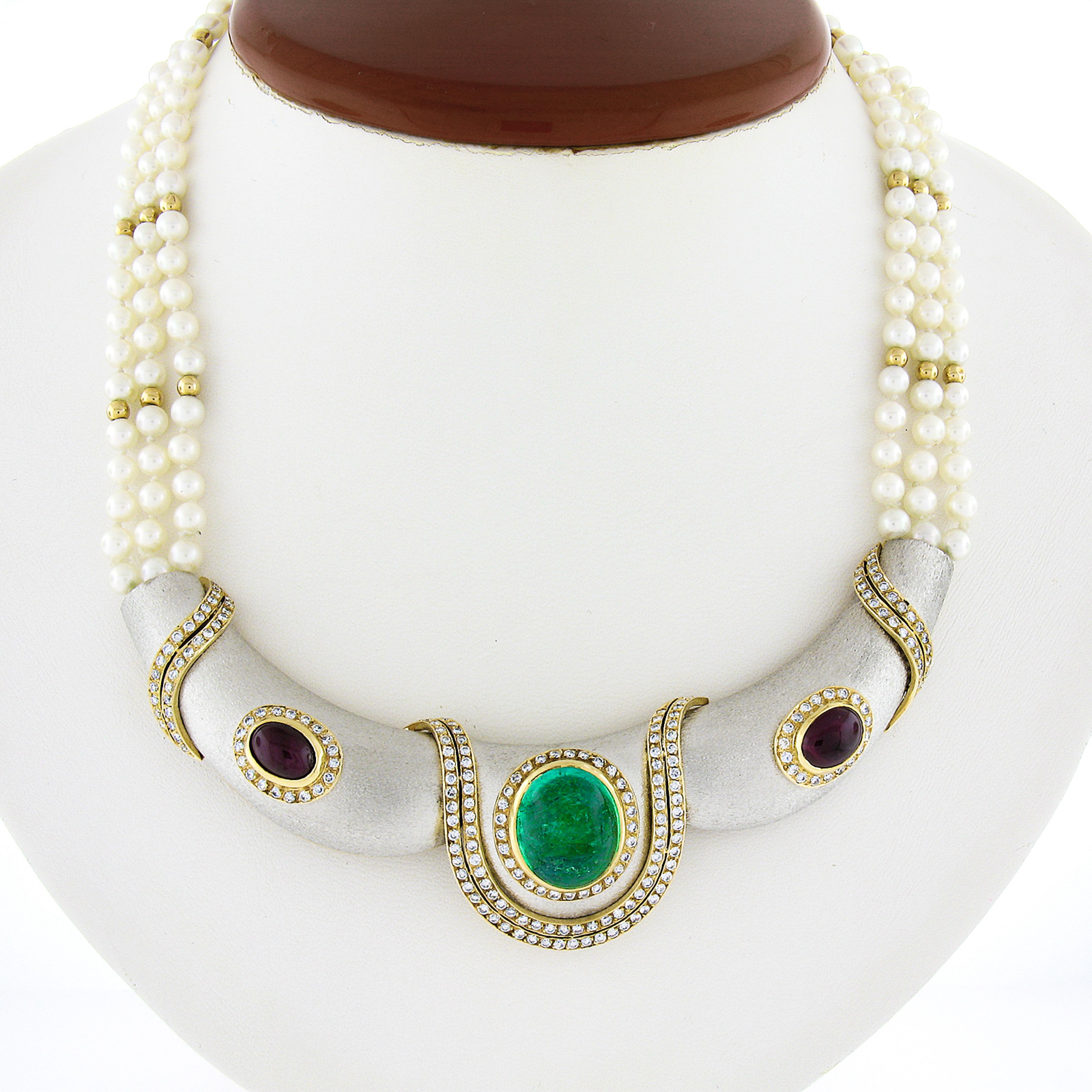 This fancy statement collar necklace is crafted in solid 18k white and yellow gold and features a truly mesmerizing and happy green Colombian emerald bezel set at its center, decorated with frosted gold finish and further adorned with fiery diamonds