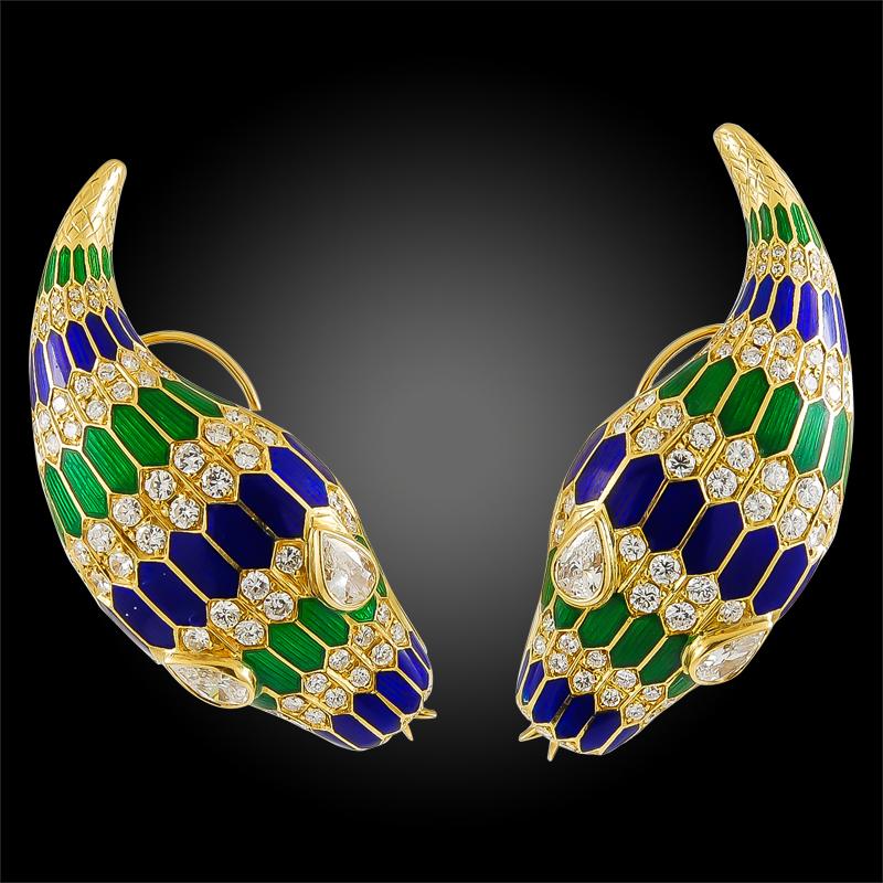 A remarkable suite that dates back to the 1970s, comprising a necklace and earrings designed as serpents, exceptionally crafted in 18k yellow gold. Each serpent is designed with brilliant diamond eyes and layered scales made of alternating rows of