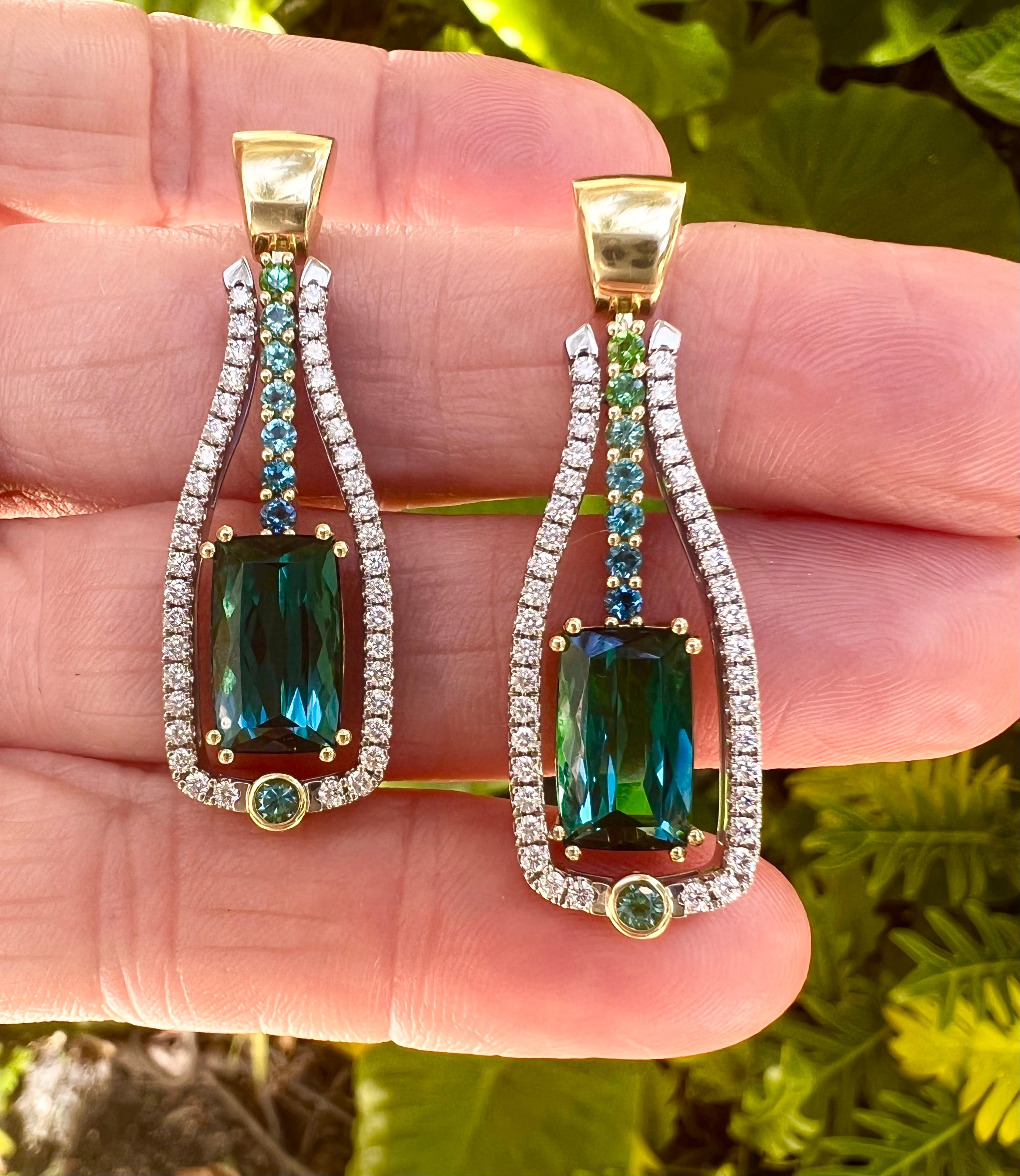 Vibrant green tourmaline and diamond drop earrings by Coffin & Trout, set in 18k two-tone white and yellow gold mountings.  Each earring top is of polished yellow gold tapered design with pierced posts and friction backs.  Central drops set with two