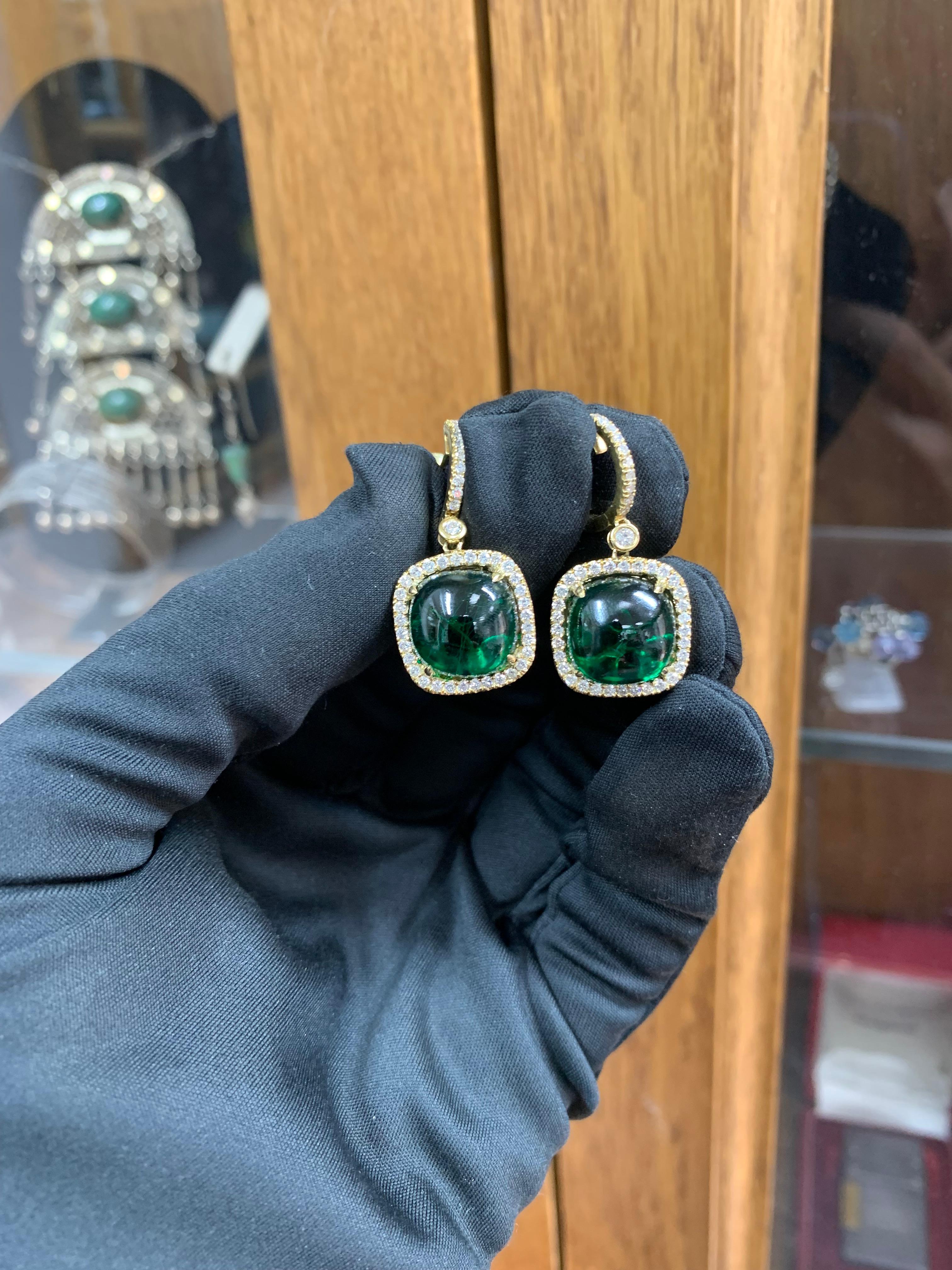 Beautifully Hand Crafted & Engraved 18k Solid Yellow Gold Earrings Set With Synthetic Green Tourmaline & Natural Diamonds.
Amazing Shine, Incredible Craftsmanship.
Approximately 6.0 Carats Of Green (Synthetic) Tourmaline.
Approximately 0.65 Carats