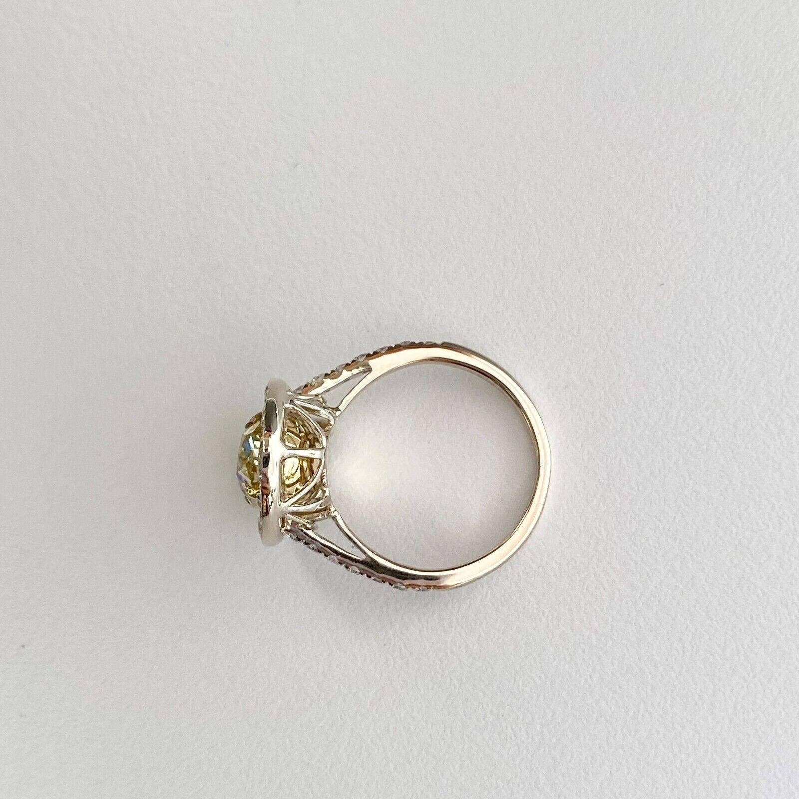 Modern 18K Gold Halo Fancy Yellow Diamond Engagement Ring 3.89ctw GIA Certified