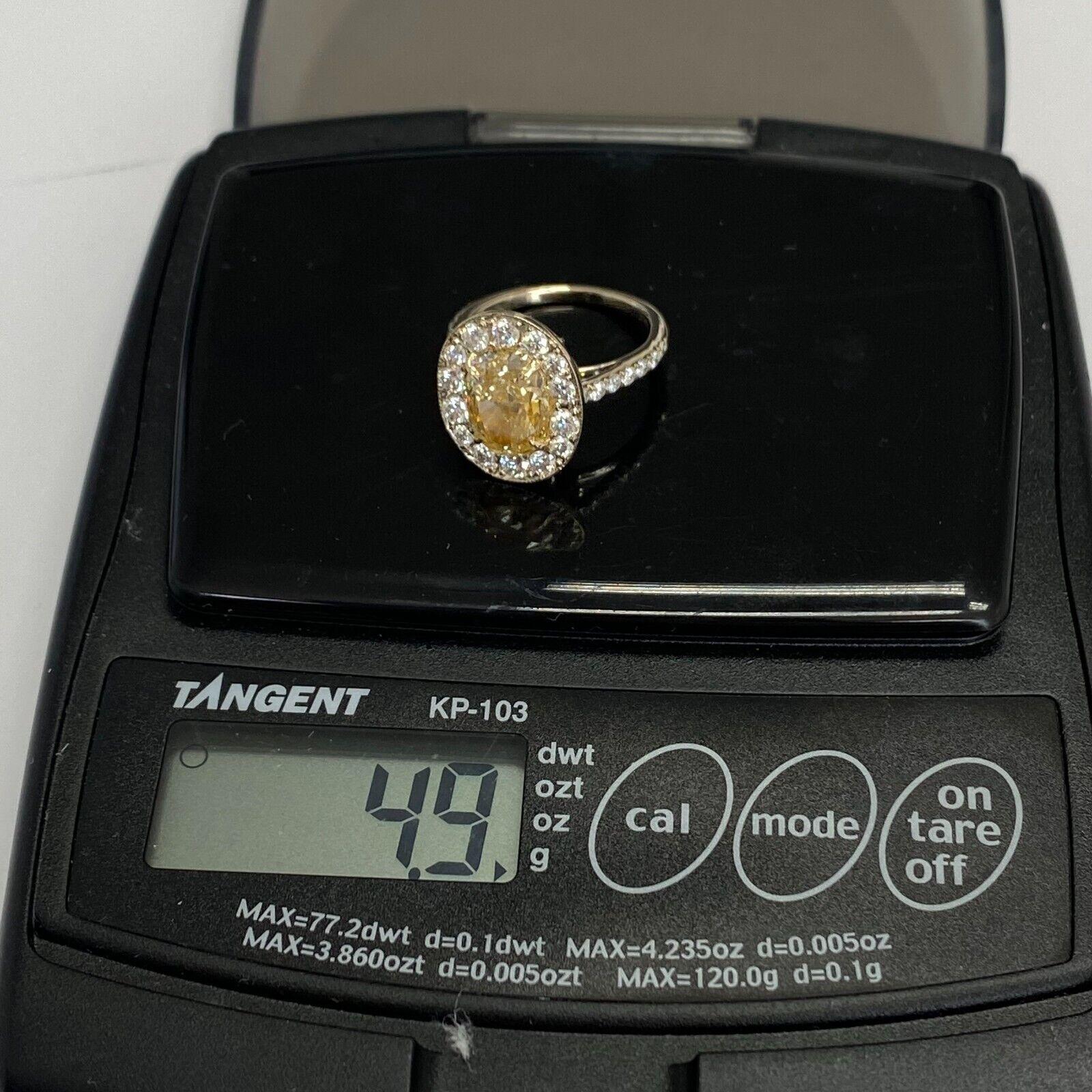 Oval Cut 18K Gold Halo Fancy Yellow Diamond Engagement Ring 3.89ctw GIA Certified