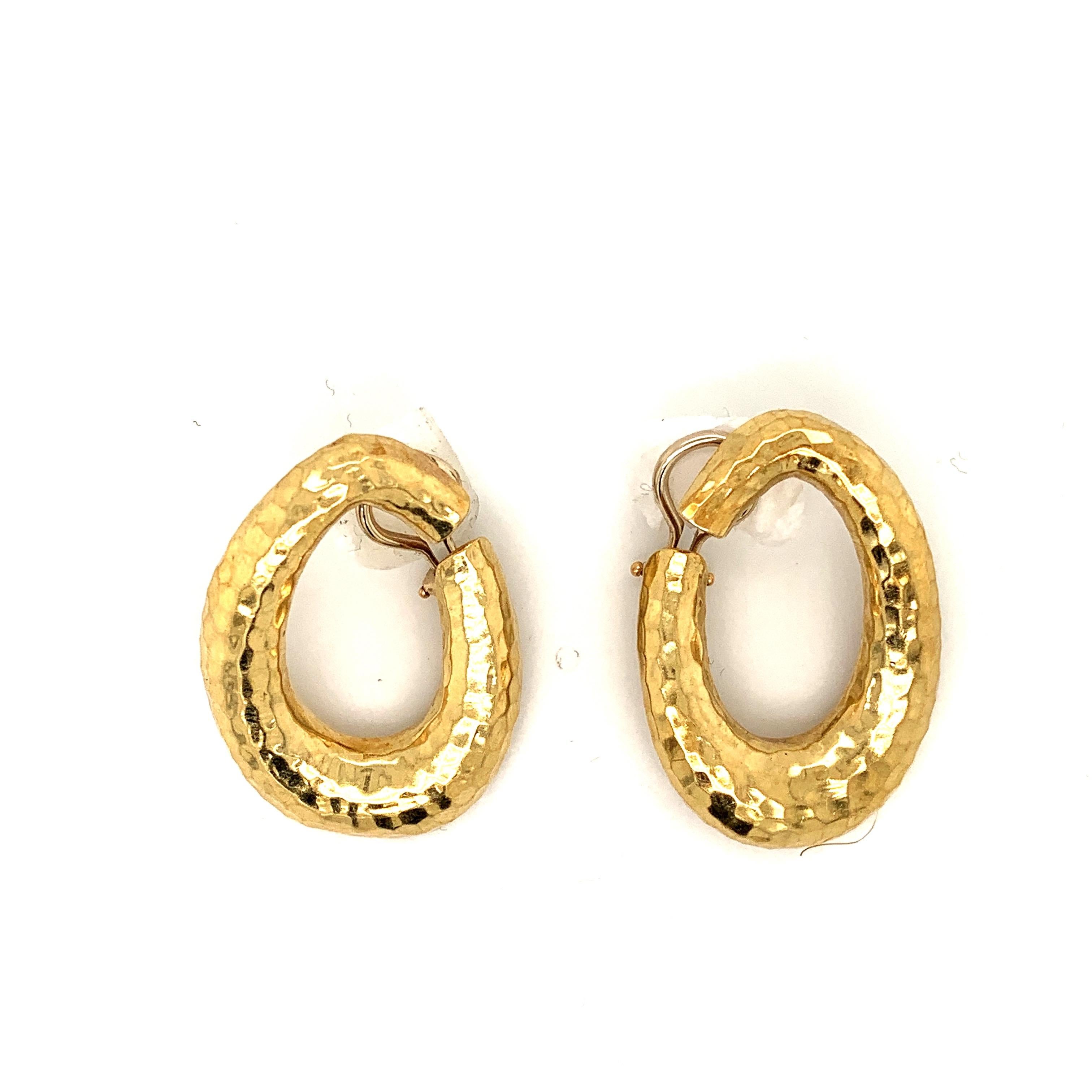 18k hammered yellow gold hoop earrings.
Handcrafted using an age old method of hand hammering. These lovely clip on earrings weighing over 17 grams of gold. Are understated yet elegant.
