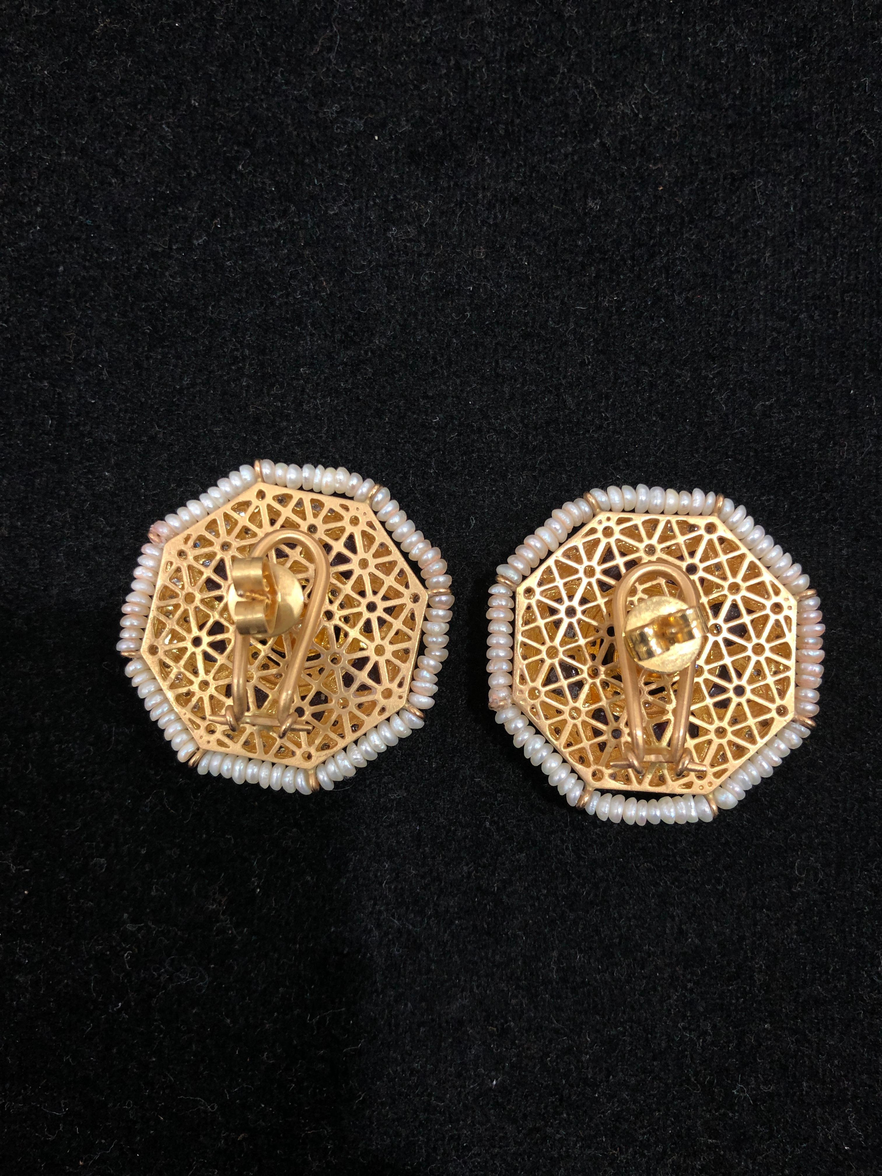 Diamond: 3.54 carats 
Pearl: 9.65 carats 
Stone: 12.70 carats 
Gold: 22.650 grams 18k 

Add these timeless pair of handcrafted earrings studded with polki, diamonds and cultured pearls to your jewellery collection and look no less than a diva 