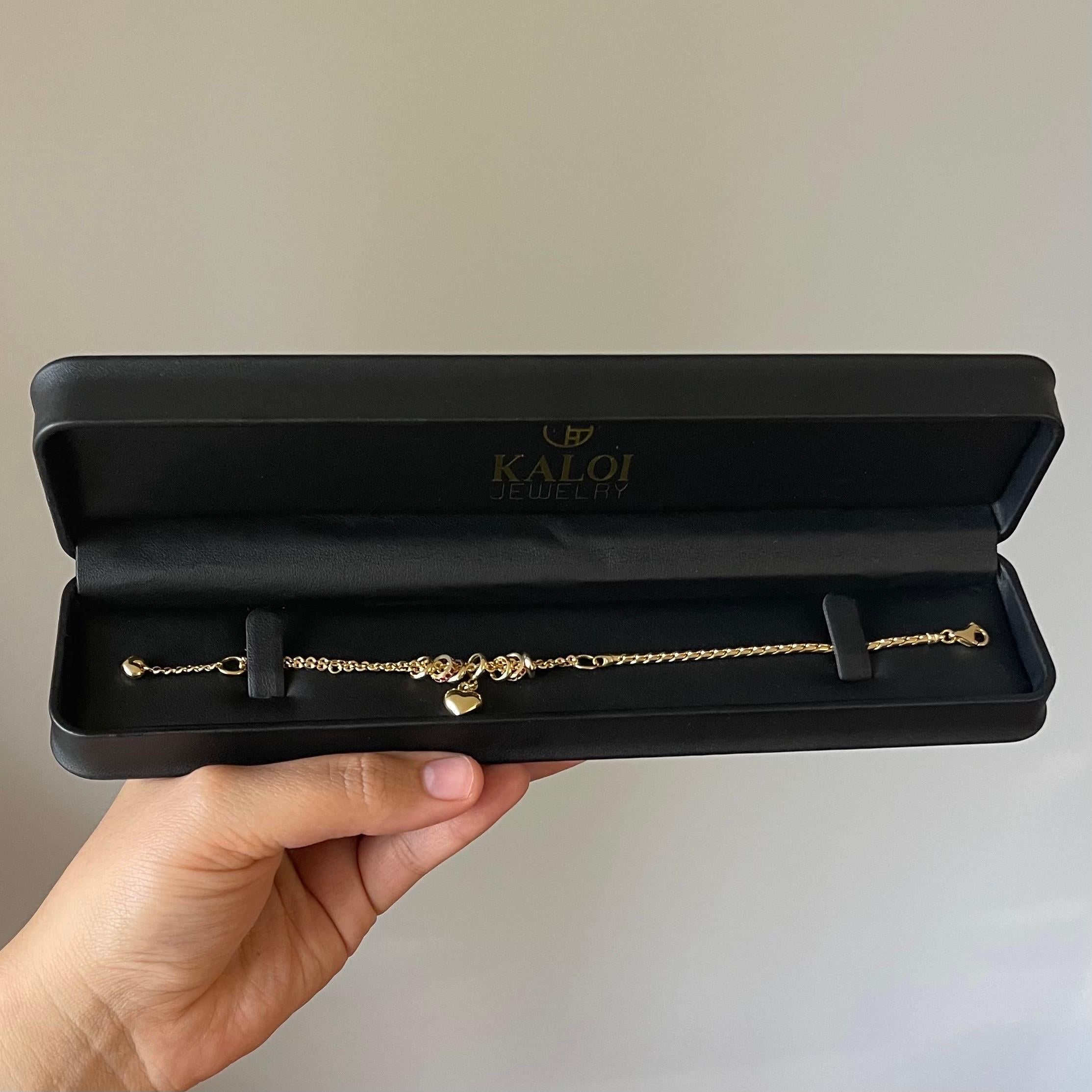da uomo o donna Bracciale a due maglie con charm a cuore in oro 18 carati e accenti di rubino in vendita