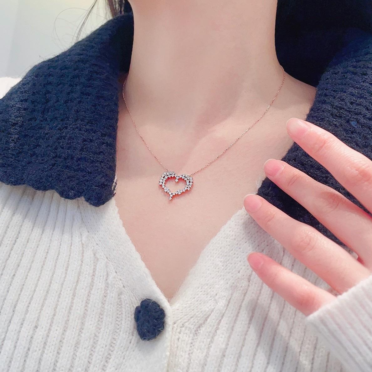 18K Gold Heart-Shaped Pave Diamond Necklace

Romantic and radiant, this 18K gold necklace features a heart-shaped silhouette encrusted with 0.53ct of pave-set natural diamonds. The design exudes timeless femininity with a contemporary edge, making