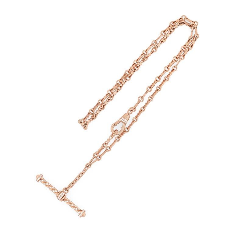 Meticulously handmade in our workshop, this 18k gold  chain is embellished with a gold and white diamond hook on the side and a dangling White Diamond pave T-Bar. The diamond encrusted hook opens up so you can put the necklace on and off easily. The