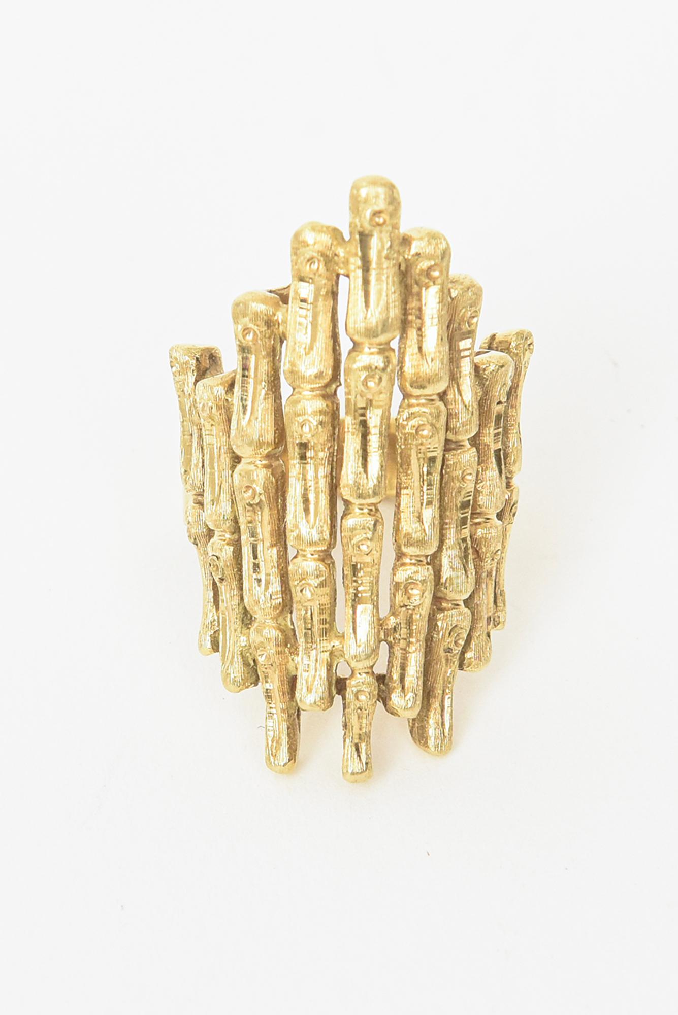 This very chic vintage 18K gold Italian ring is either for dress or every day wear. Great cocktail ring. The staggered bamboo designs make for an elongated presence on the finger. Very finely made and hallmarked as shown. It says inside 5U 250Iable