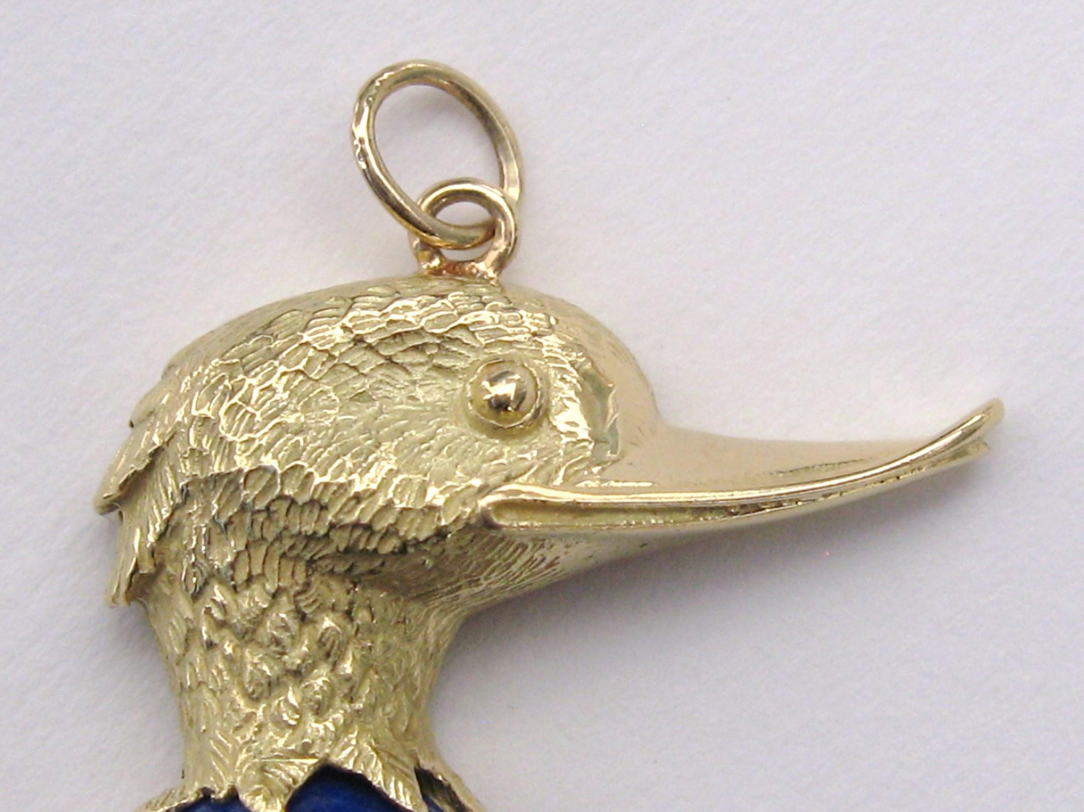 A duck in motion, with a lapis lazuli stone as it's body. This is precious! 18K gold. Measuring 1.50in top to bottom x .96in. wide.  This is out of our massive collection of Contemporary designer & Vintage clothing as well as Hopi, Zuni, Navajo,