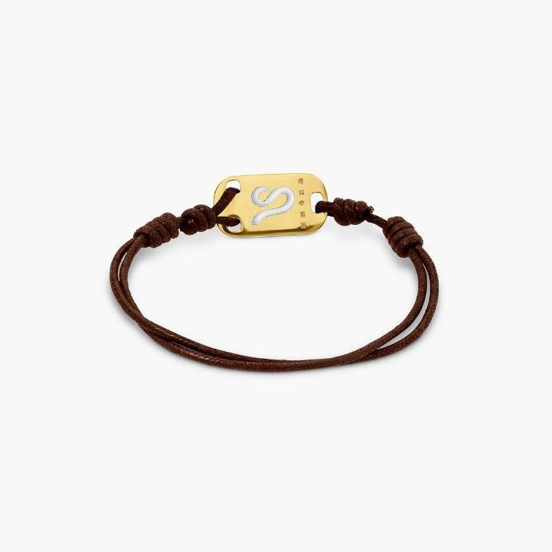 18K Gold Leo Bracelet with Brown Cord

Celebrate the Leo in your life with this timeless cord bracelet featuring a gold star sign tag for a personal touch. Whether it's for yourself or a birthday gift, the effortless style can be worn for any