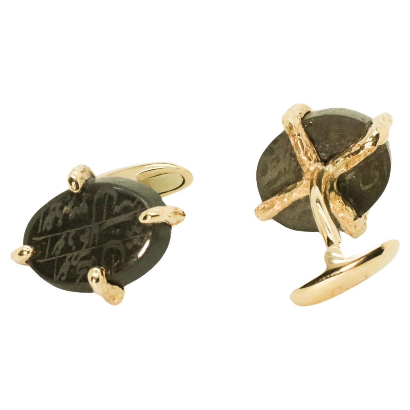 The Brotherhood cufflinks are made of 18 karat rose gold and features 2  agates engraved by hand with protective words and a cross designed in gold on the back. It is a powerful protective talisman that merges symbols of different cultures.  They