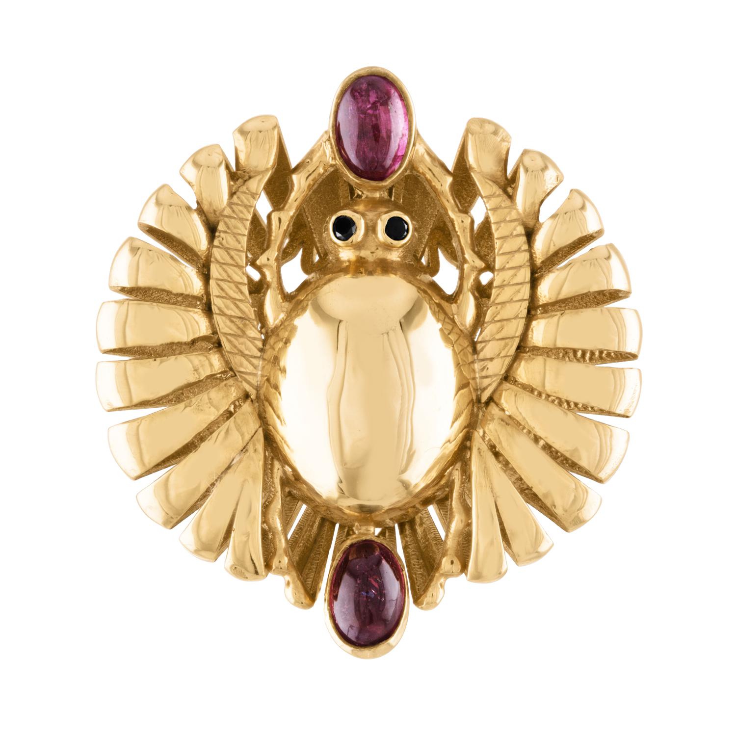 This cocktail ring features an open winged scarab talisman. In Sterling silver or Micron yellow gold plate, this is surely classic and timeless yet contemporary in style. Stones are cabernet red garnets with accents of chocolate diamonds for the