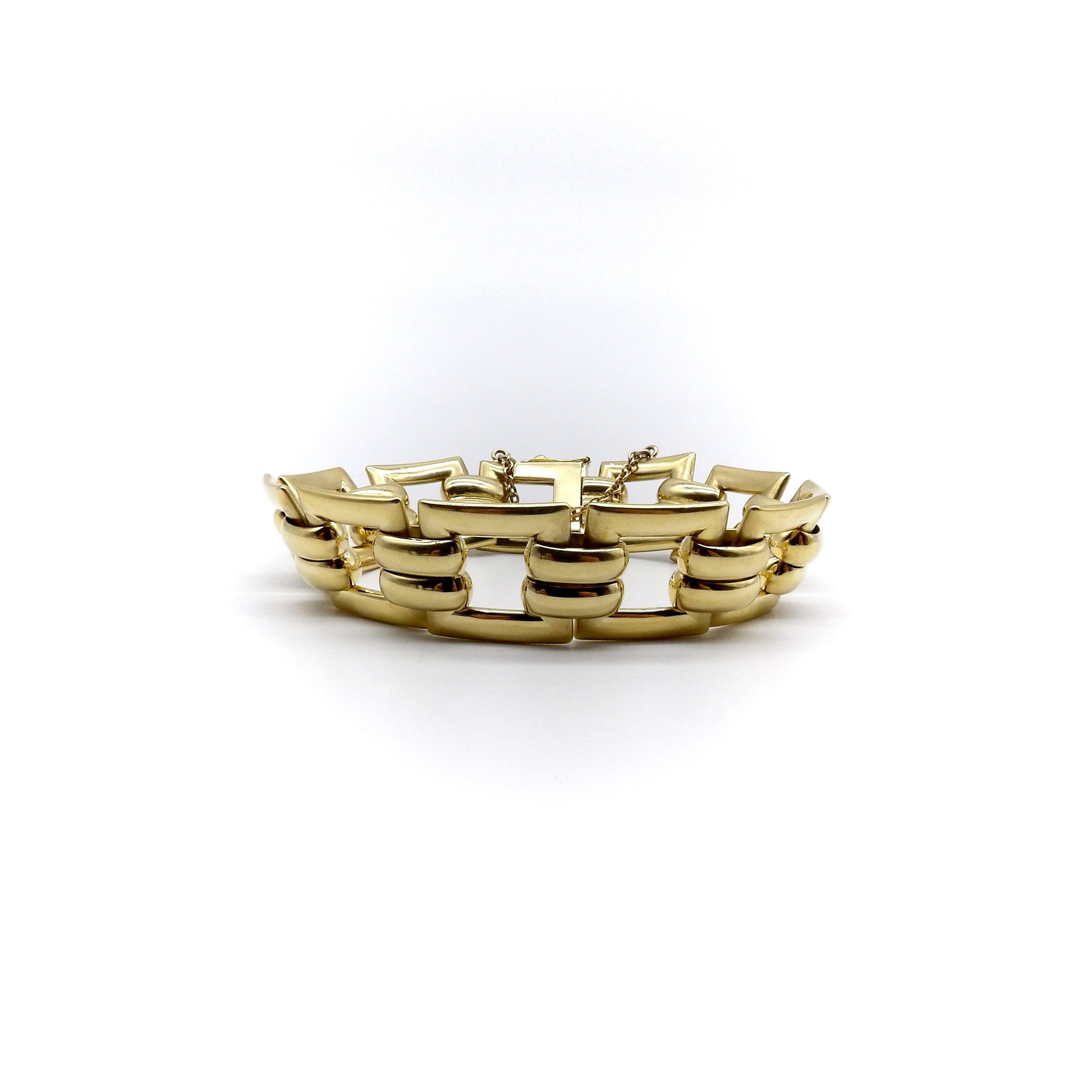 This mid-century French bracelet alternates between a square link and ribbed middle section. Both links and ribs are dimensional, as they are slightly convex, allowing them to lay nicely against the wrist. They are sculptural in nature, and the